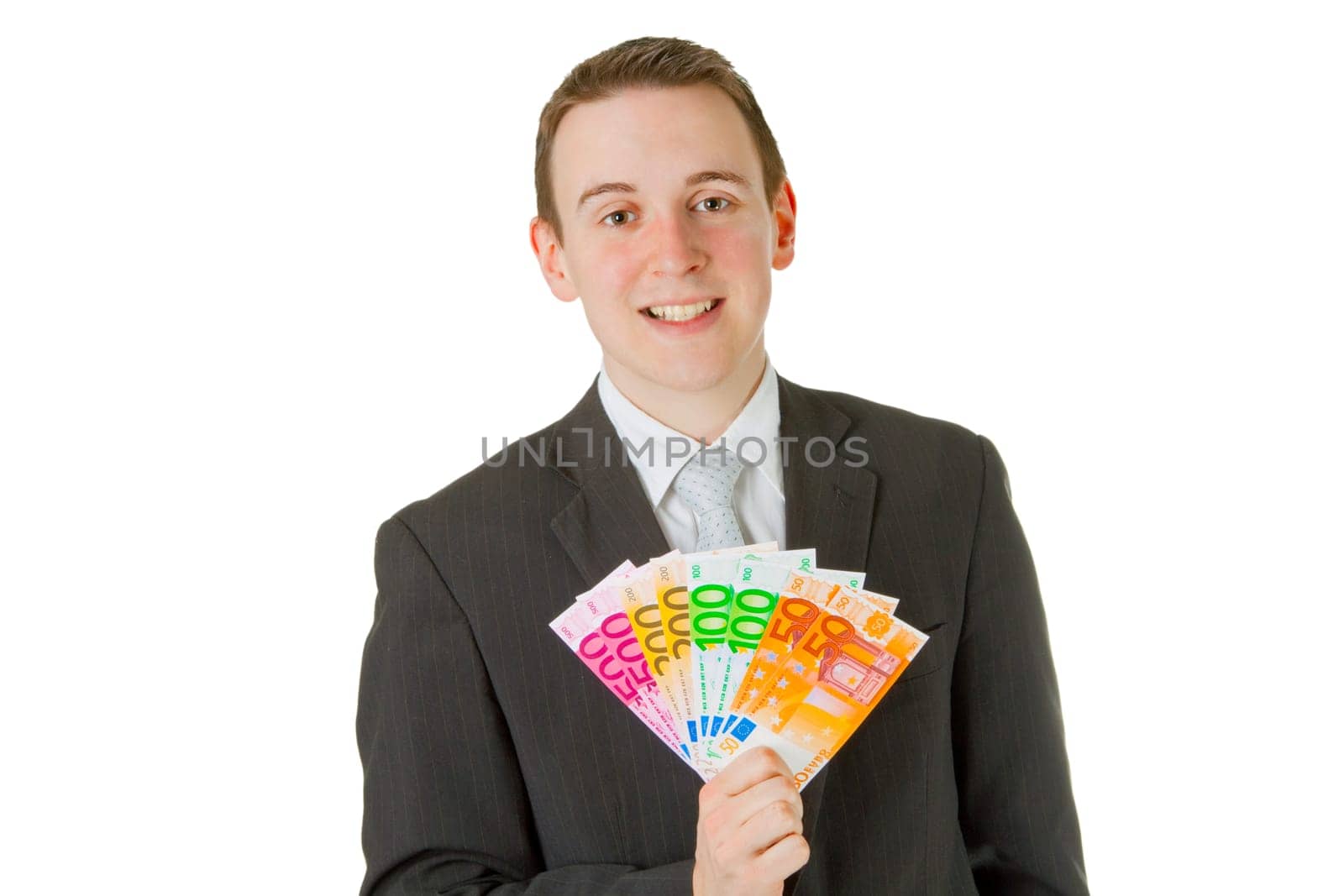 Young businessman with banknotes isolated on white background