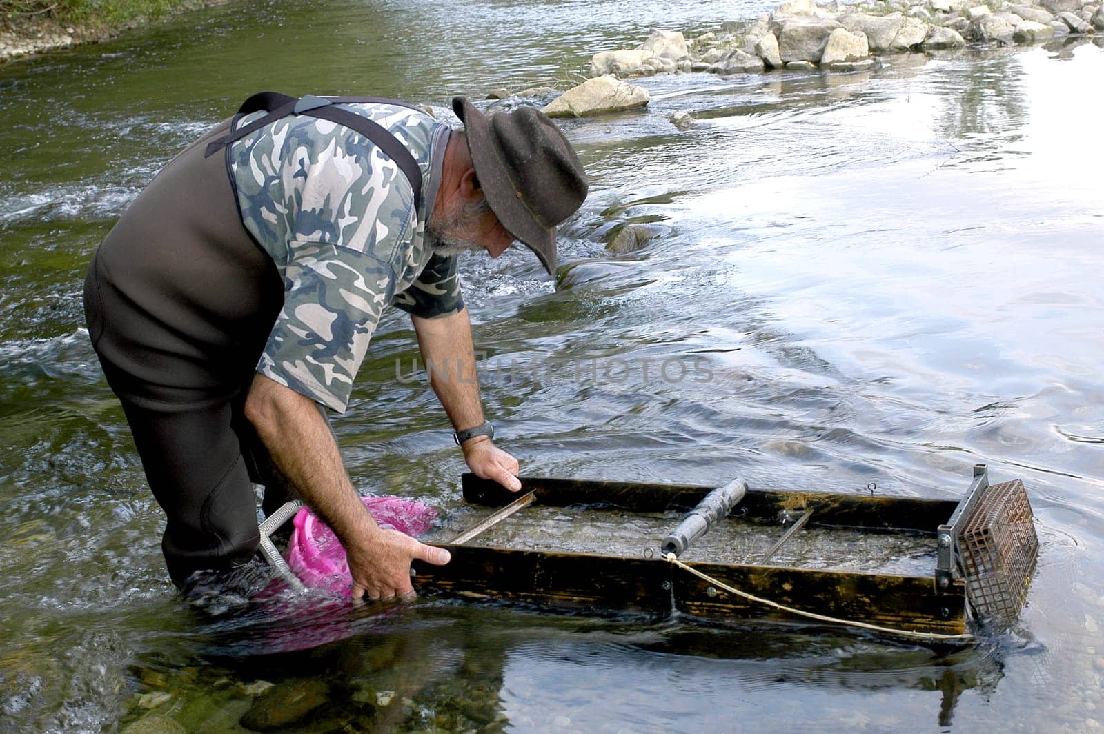 prospector panning for gold in rivers in France in the Gard region