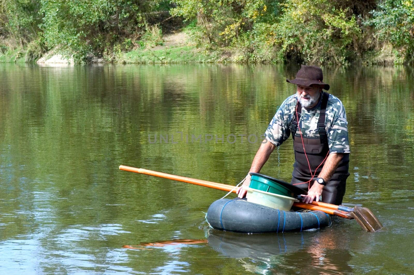 prospector panning for gold in rivers in France in the Gard region