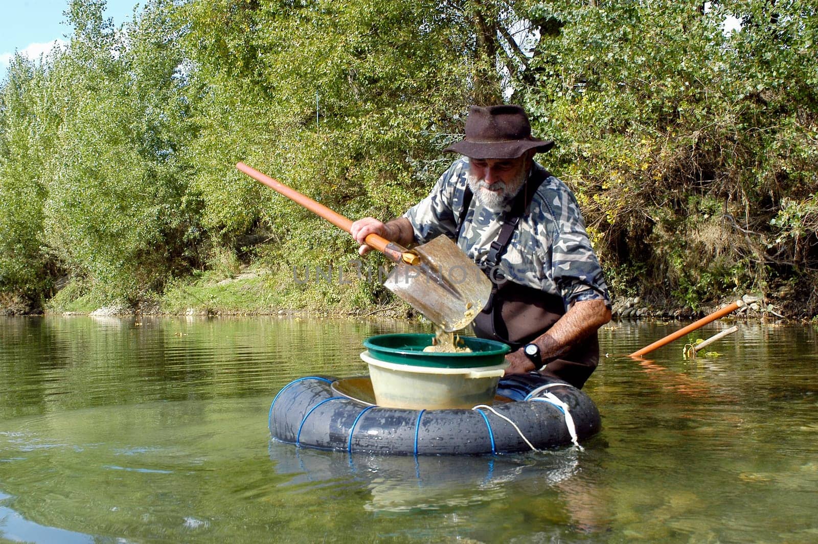 prospector panning for gold in rivers in France in the Gard region