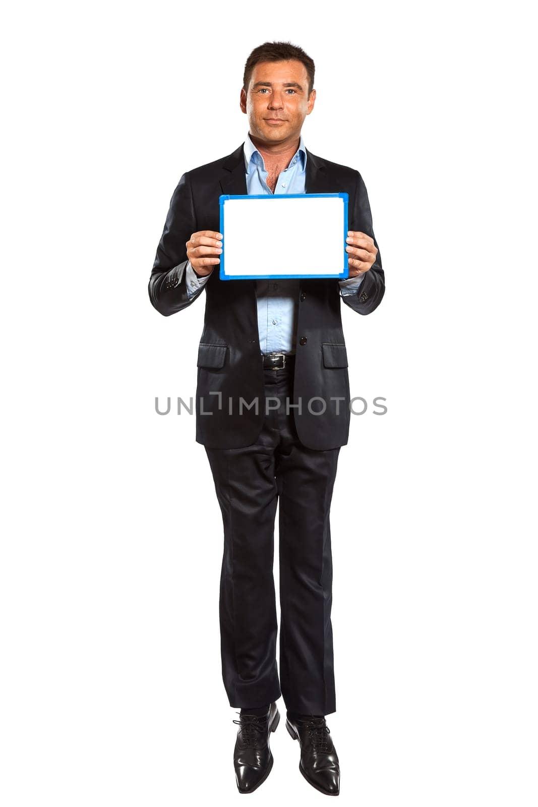 one caucasian business man  jumping holding showing whiteboard in studio isolated on white background