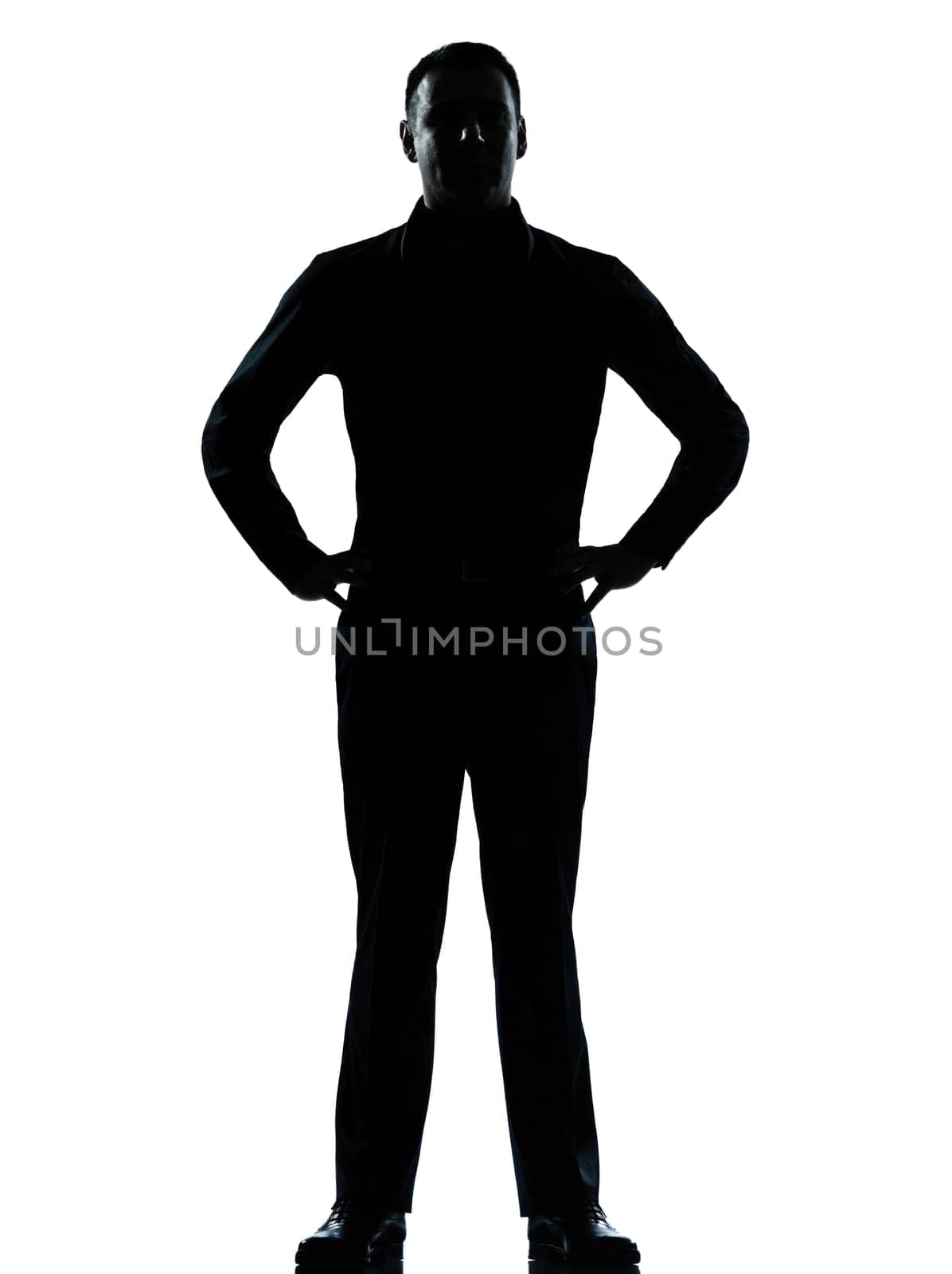 one caucasian business man silhouette standing hands on hips Full length in studio isolated on white background