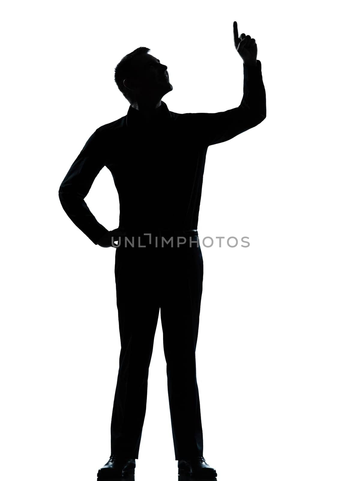 one caucasian business man poiting up happy  silhouette standing Full length in studio isolated on white background