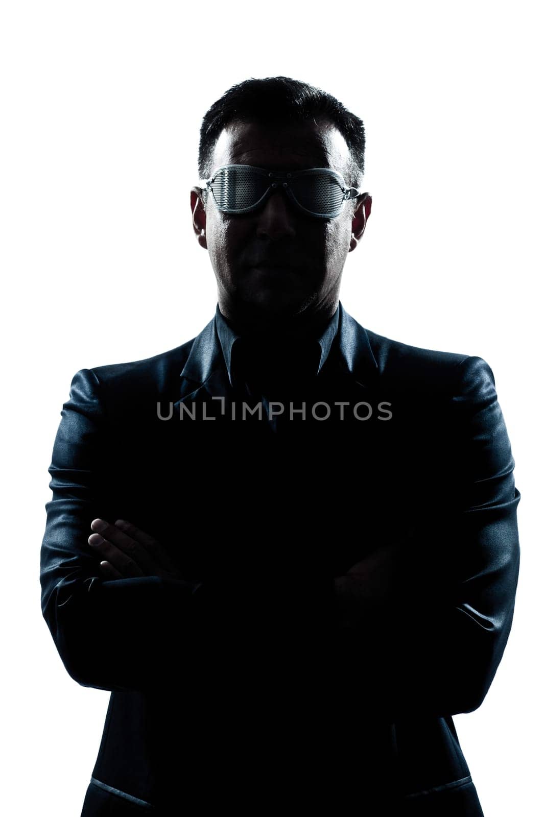 one caucasian man portrait silhouette serious arms crossed strange glasses in studio isolated white background
