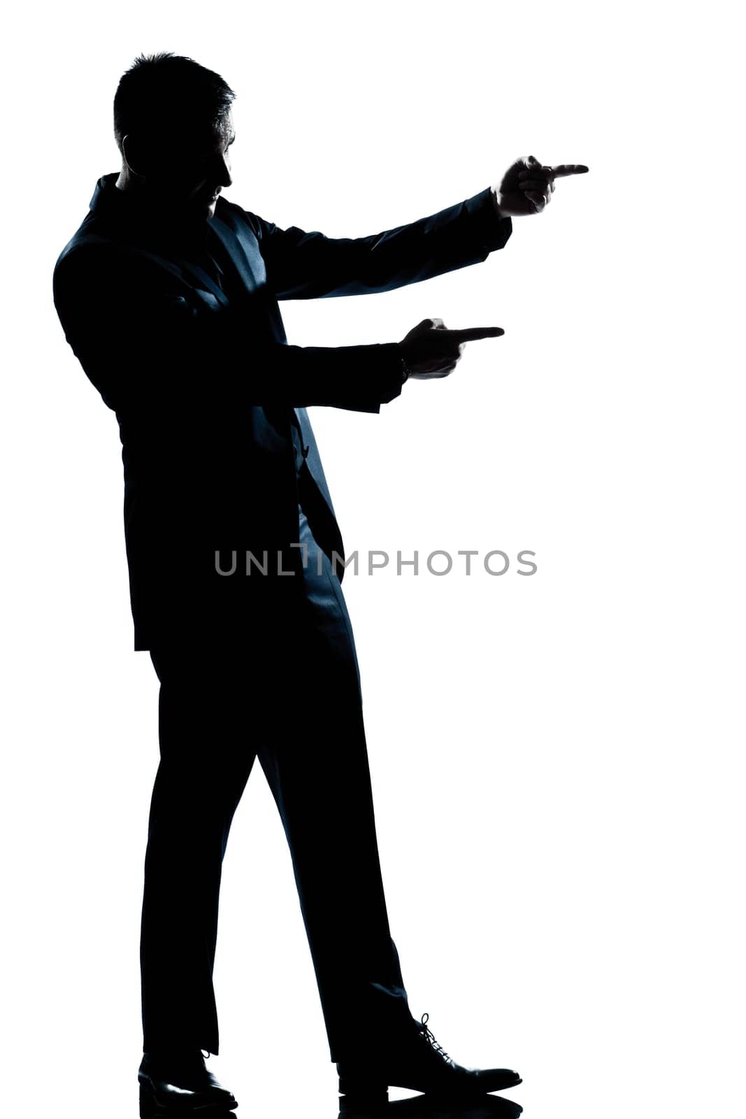 one caucasian man showing pointing empty copy space  full length silhouette in studio isolated white background