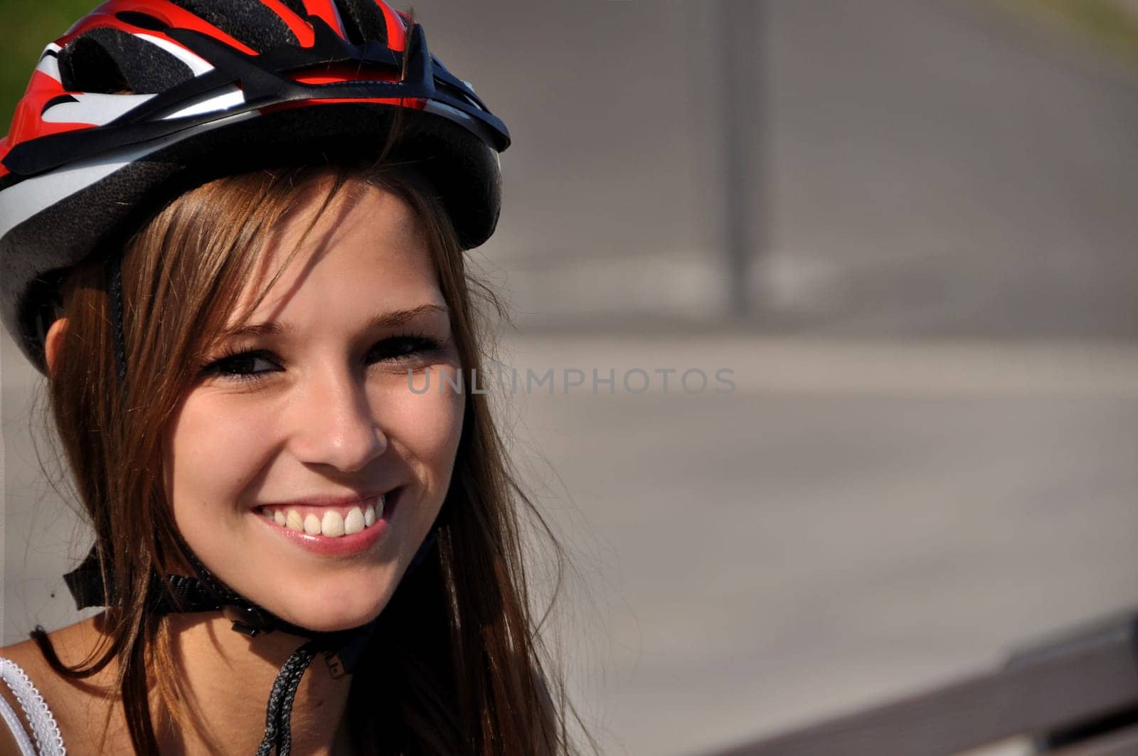 Woman shows a lot of joy in outdoor sports in good weather