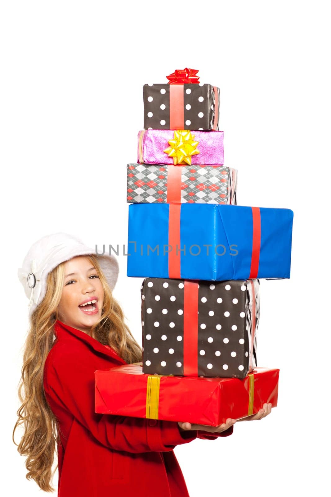 kid girl holding many gifts stacked on her hand isolated on white