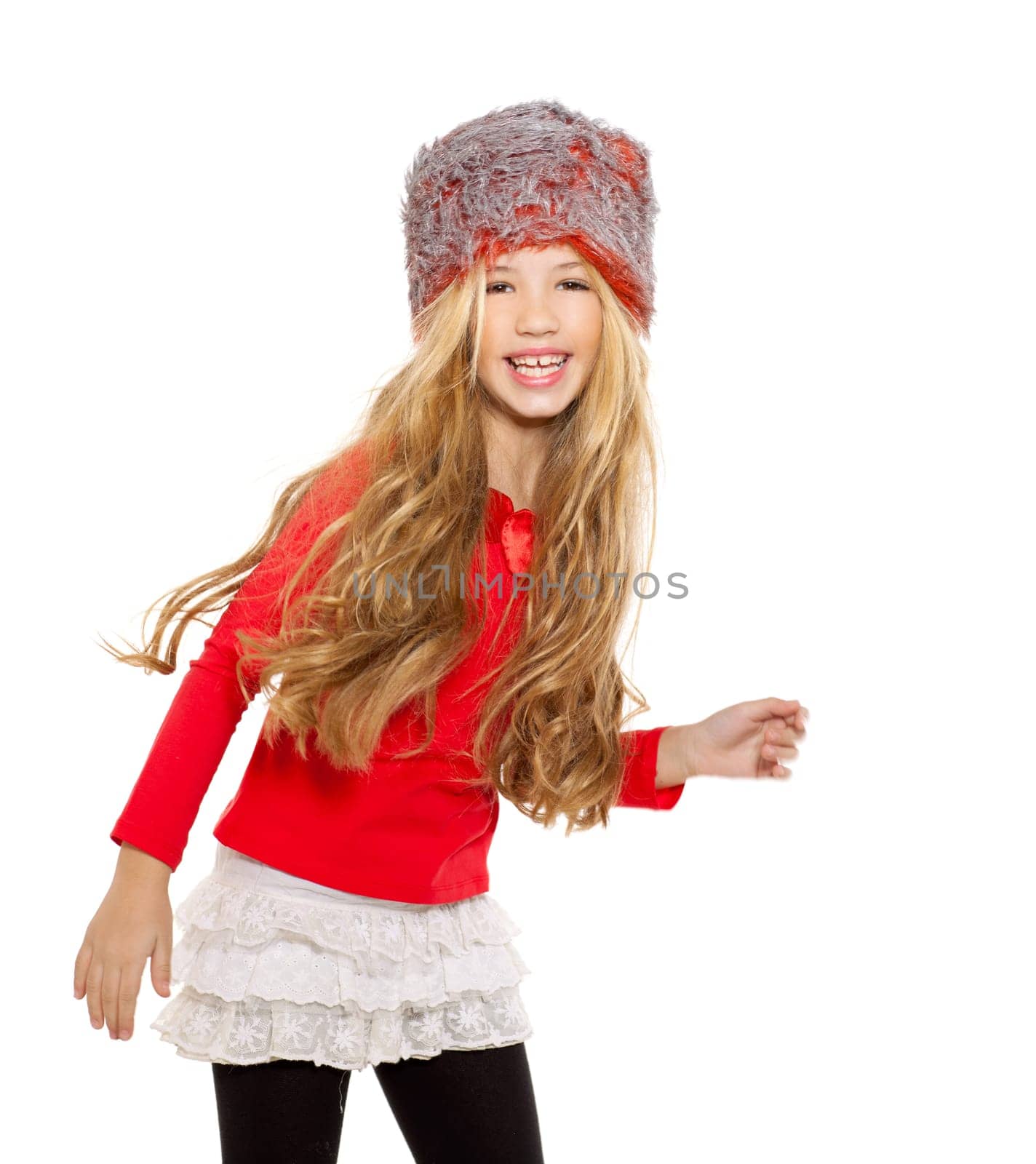 kid girl winter dancing with red shirt and fur hat on white background