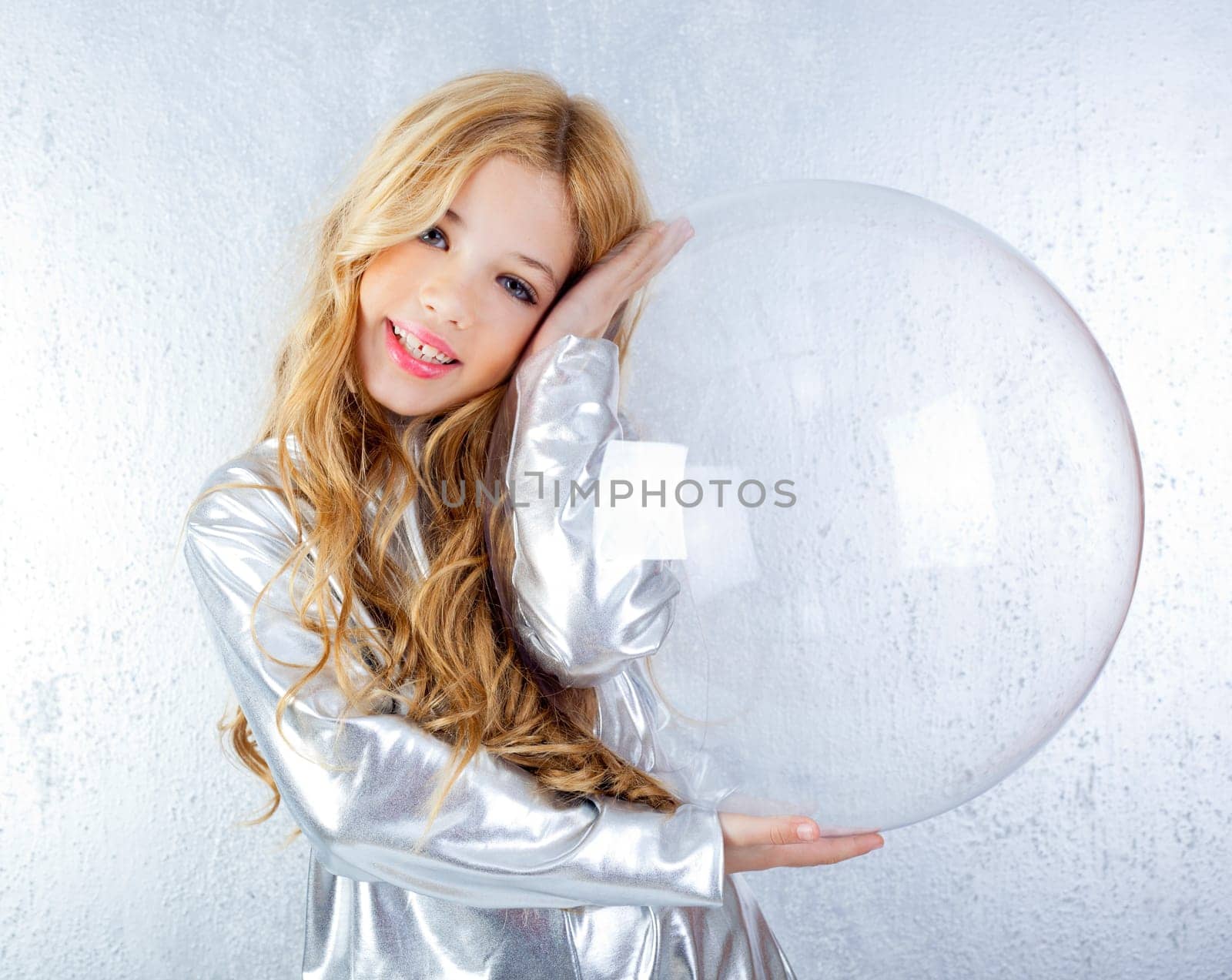 Astronaut futuristic kid girl with silver uniform and glass helmet