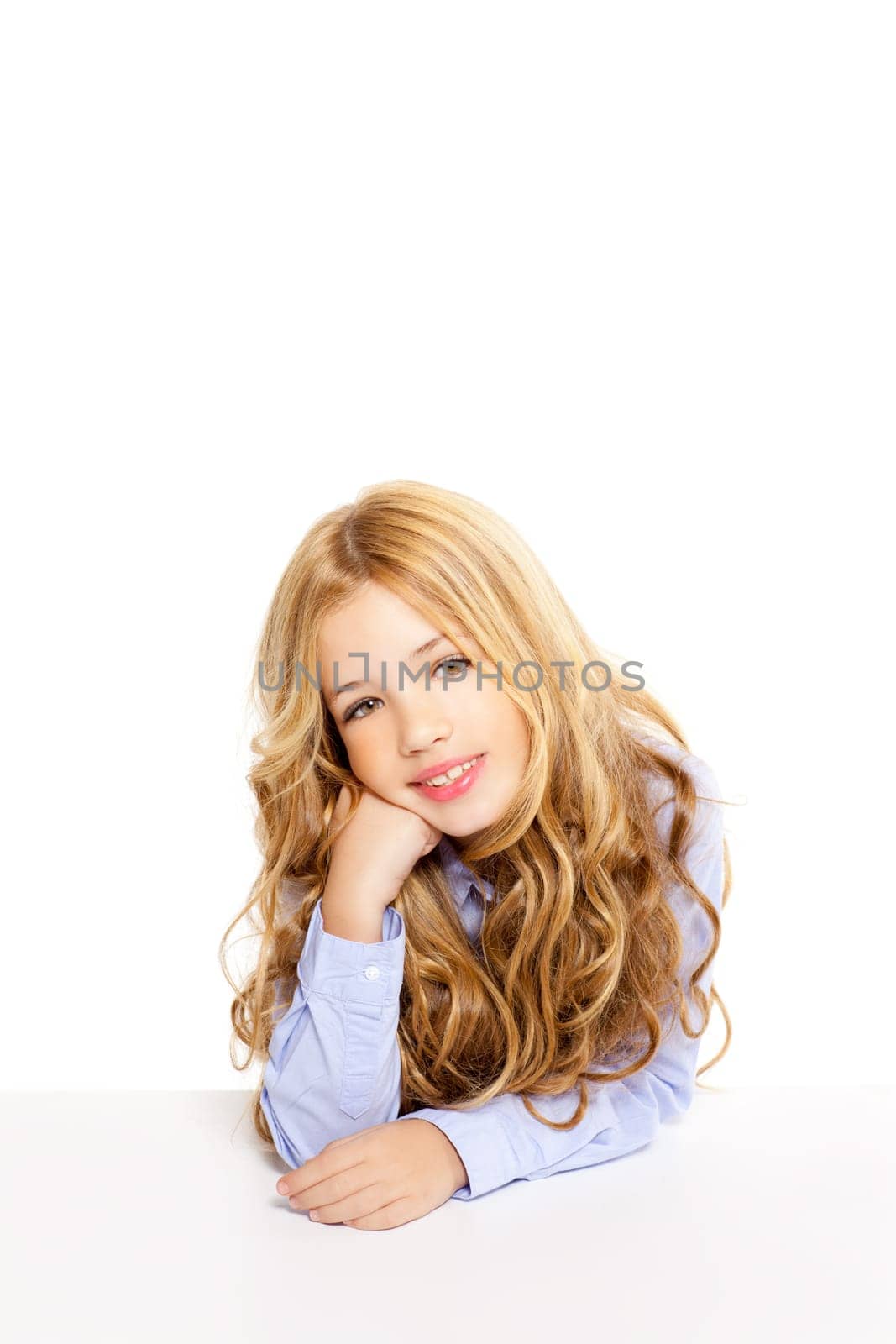 blond kid little student girl portrait smiling on a desk in white background