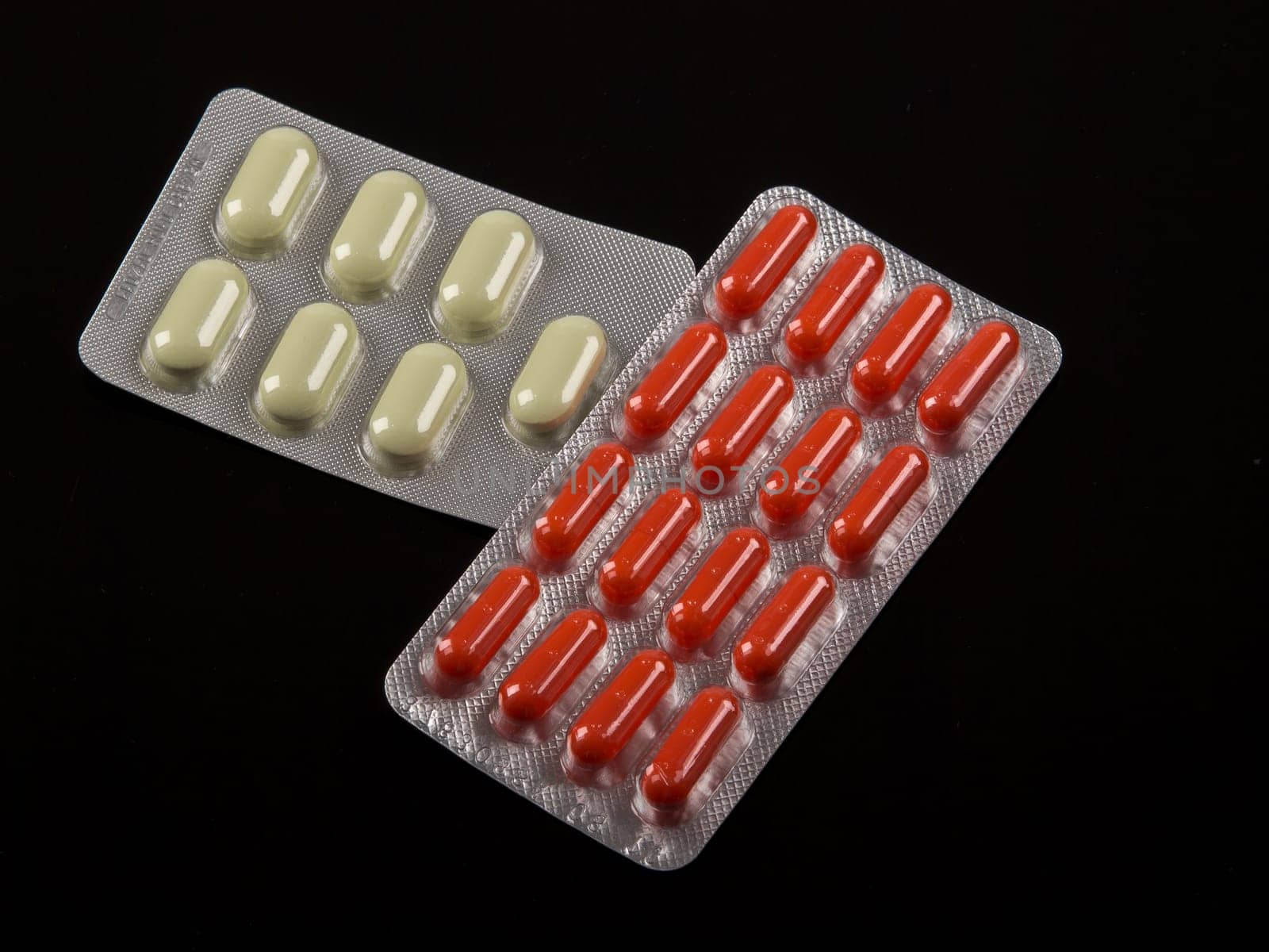 different medical pils on black table