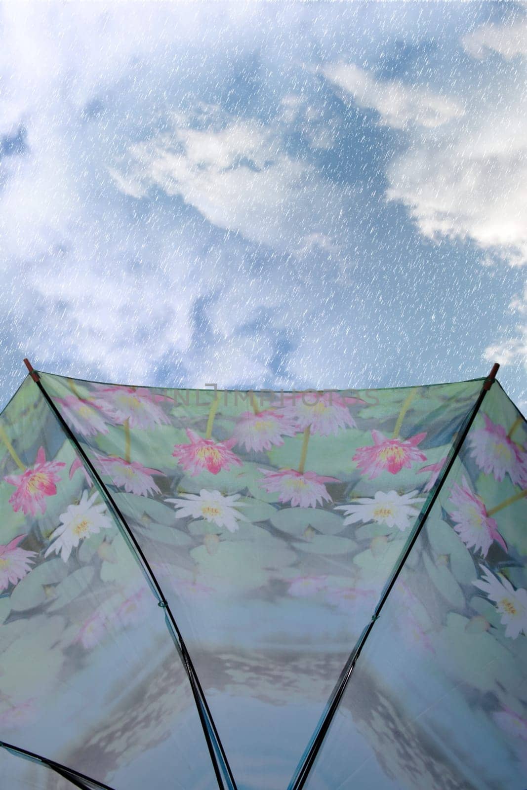 view from under an umbrella of a stormy wet and rainy cloudy day