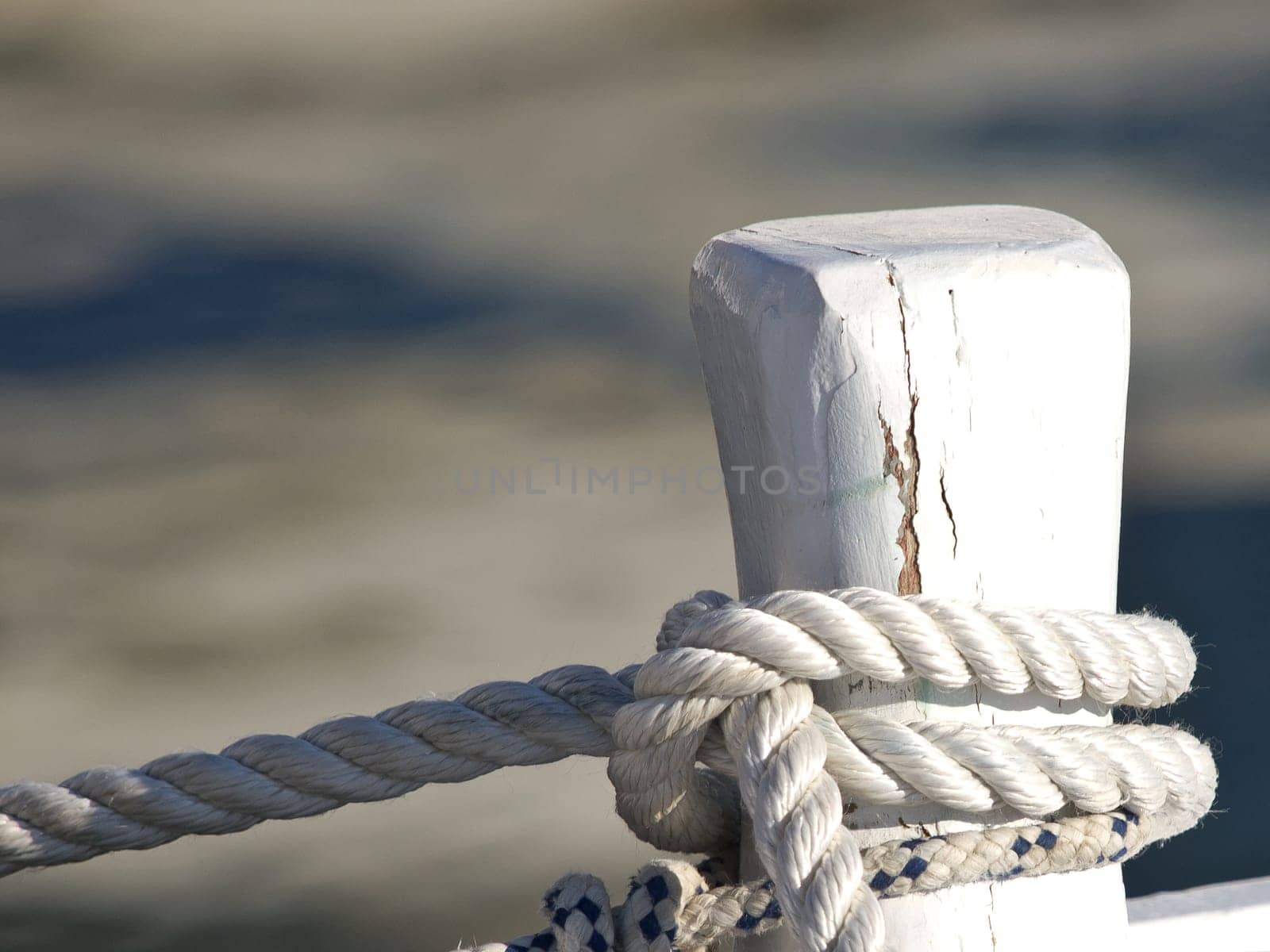 ropes on the boat docked in the harbour
