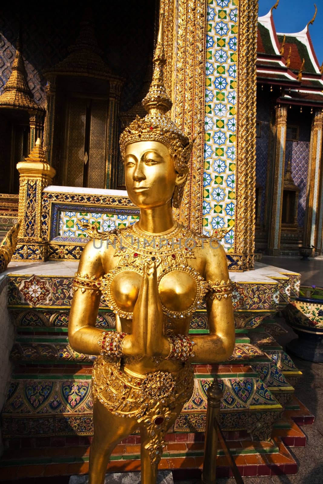 a kinaree, a mythology figure, is watching the temple in the Grand Palace