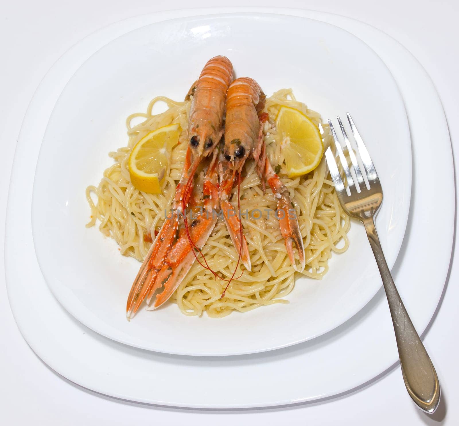 pasta with shrimps on the plate