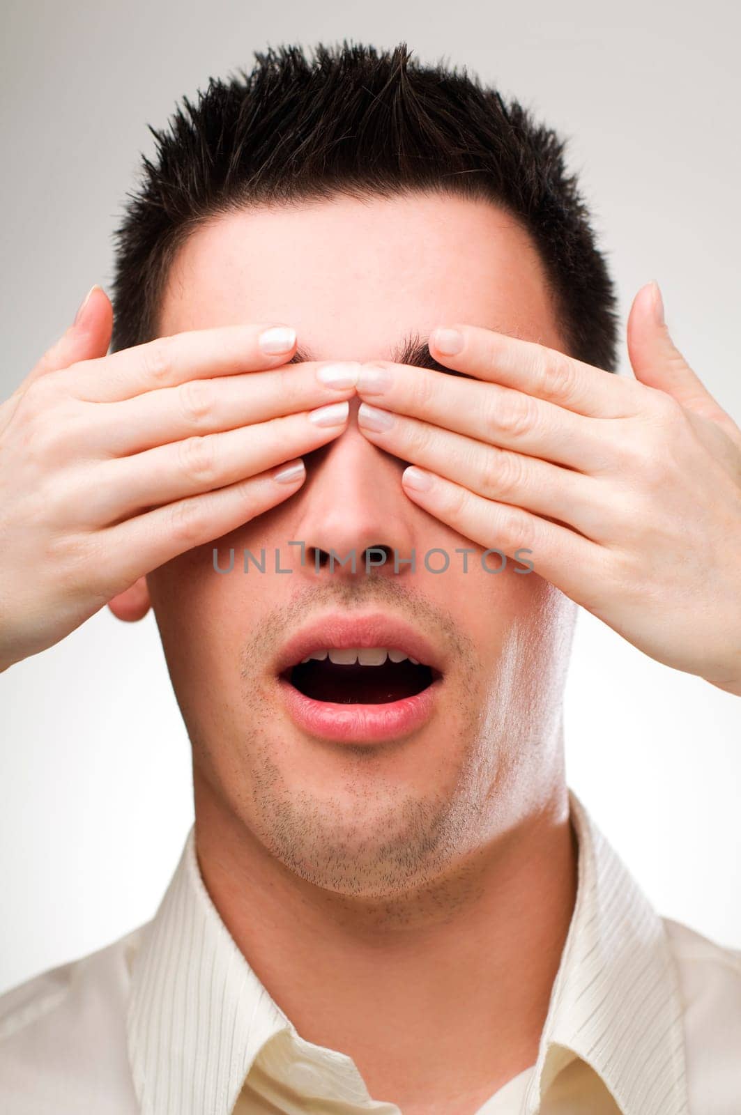 Woman hands ower young man eyes close up