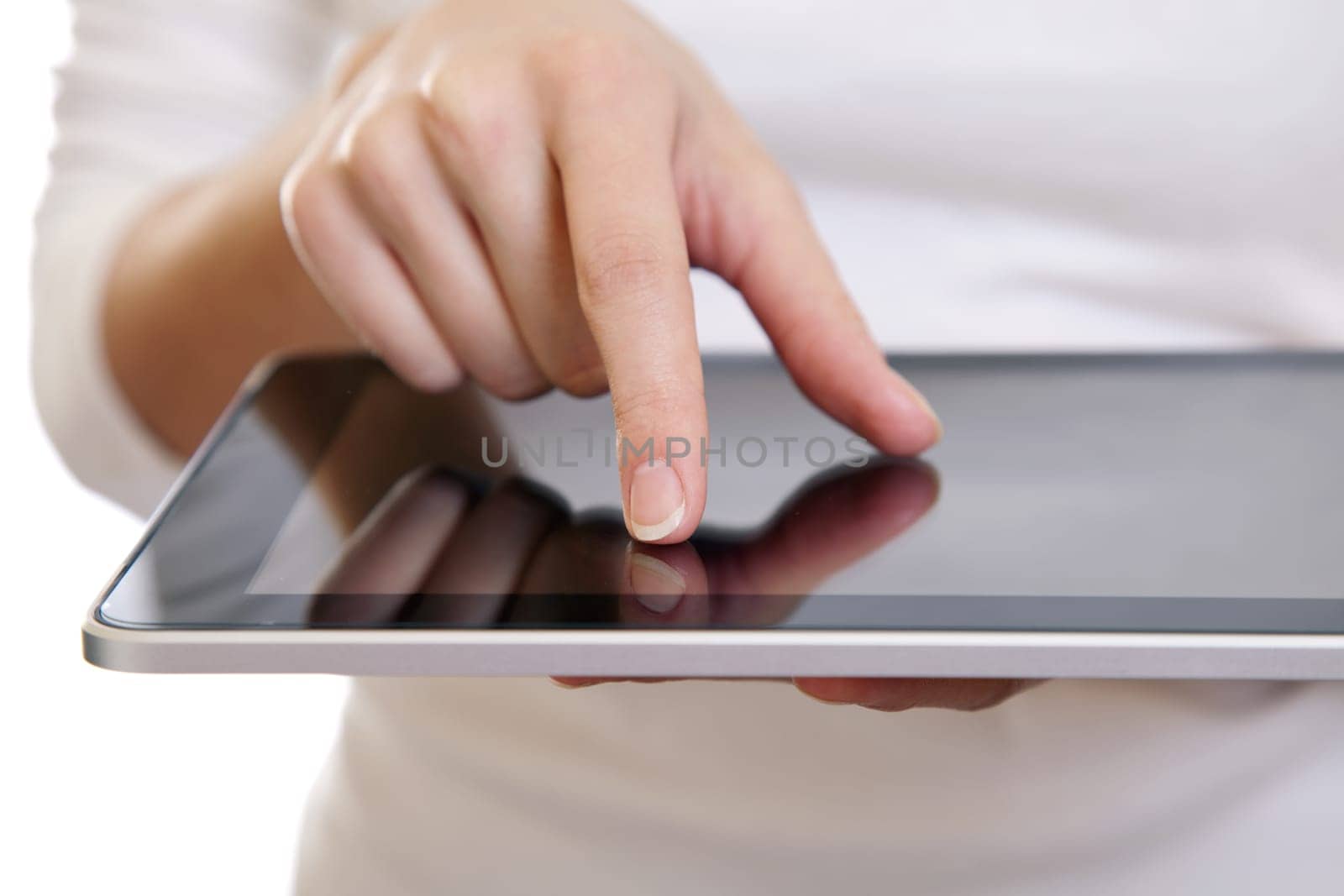 Hand of a woman using a digital tablet on white