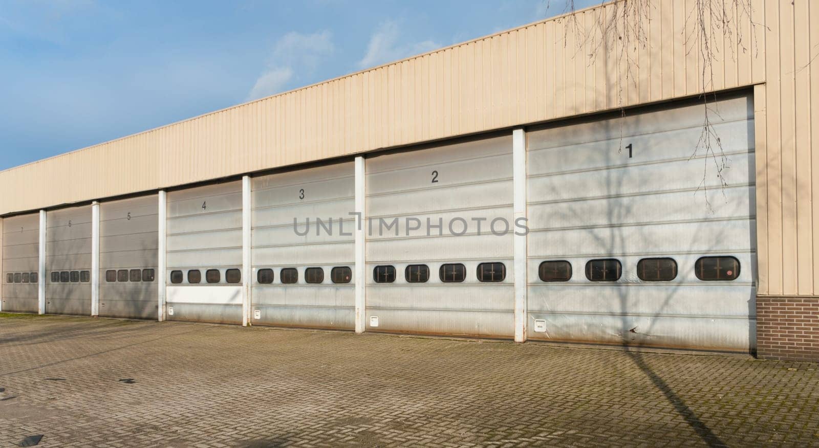 industrial unit with old and damages roller shutter doors