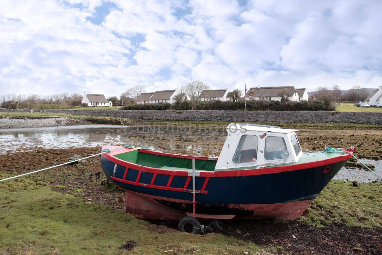 an old boat in a bay in ireland