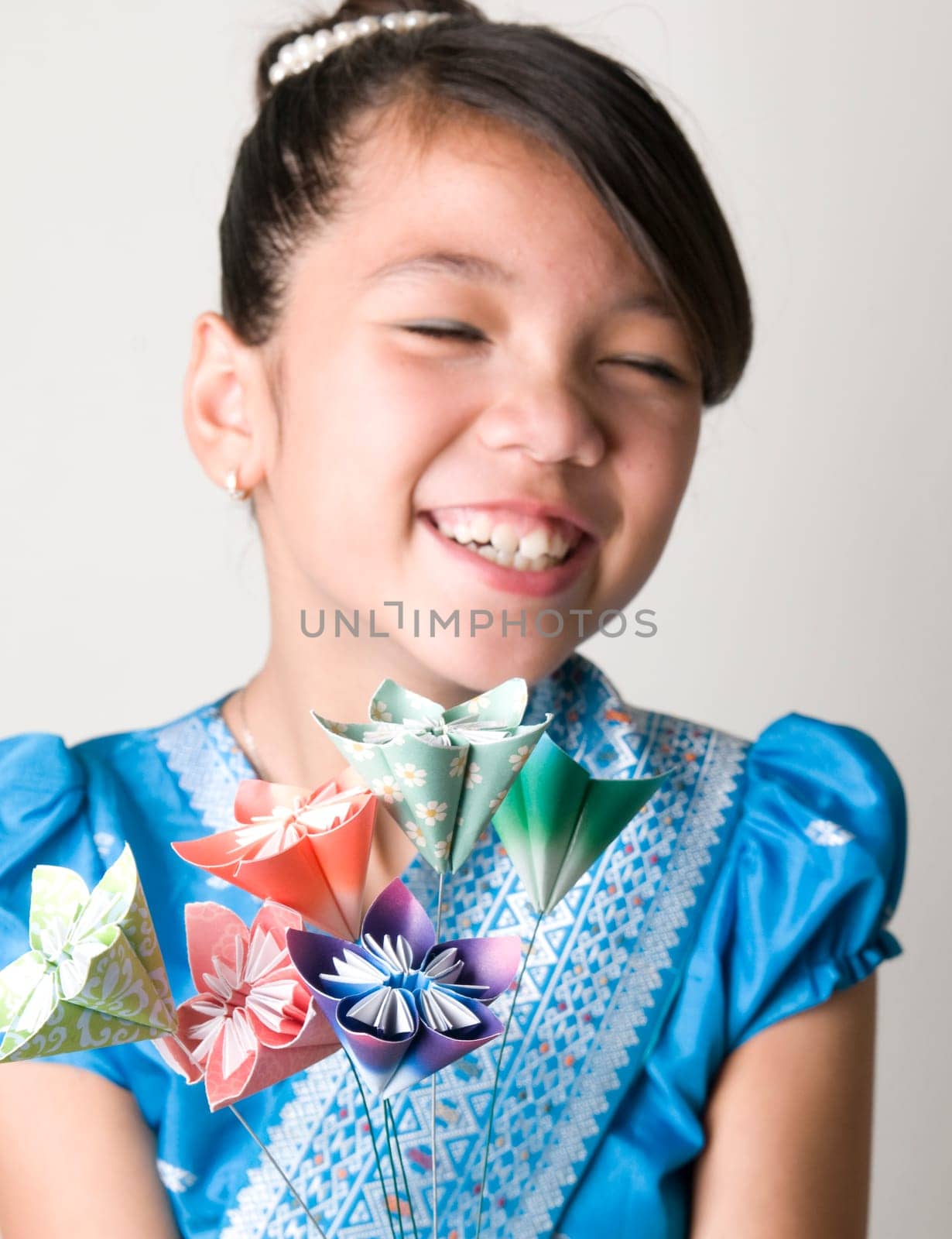 Asian Girl with Origami Flowers