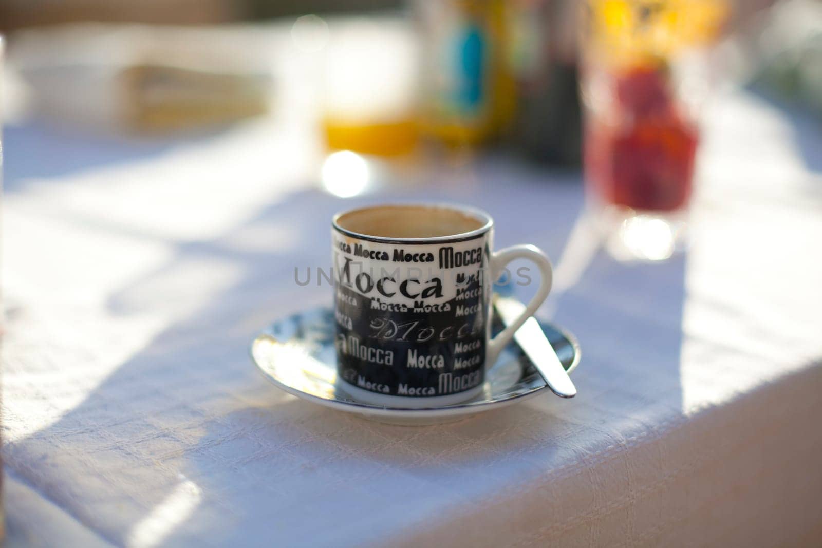 Close-up of a coffee cup on an outdoor table