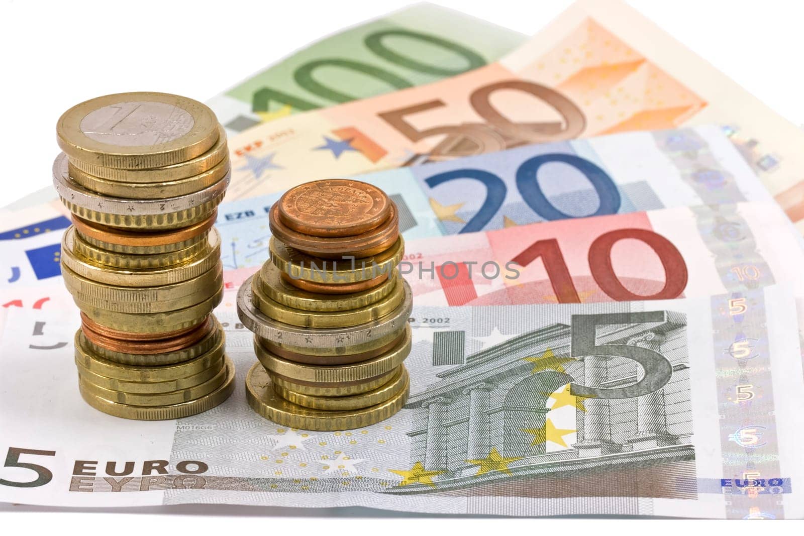 Close-up of the fan of 5, 10, 20, 50, 100, Euro banknotes and coins on white background