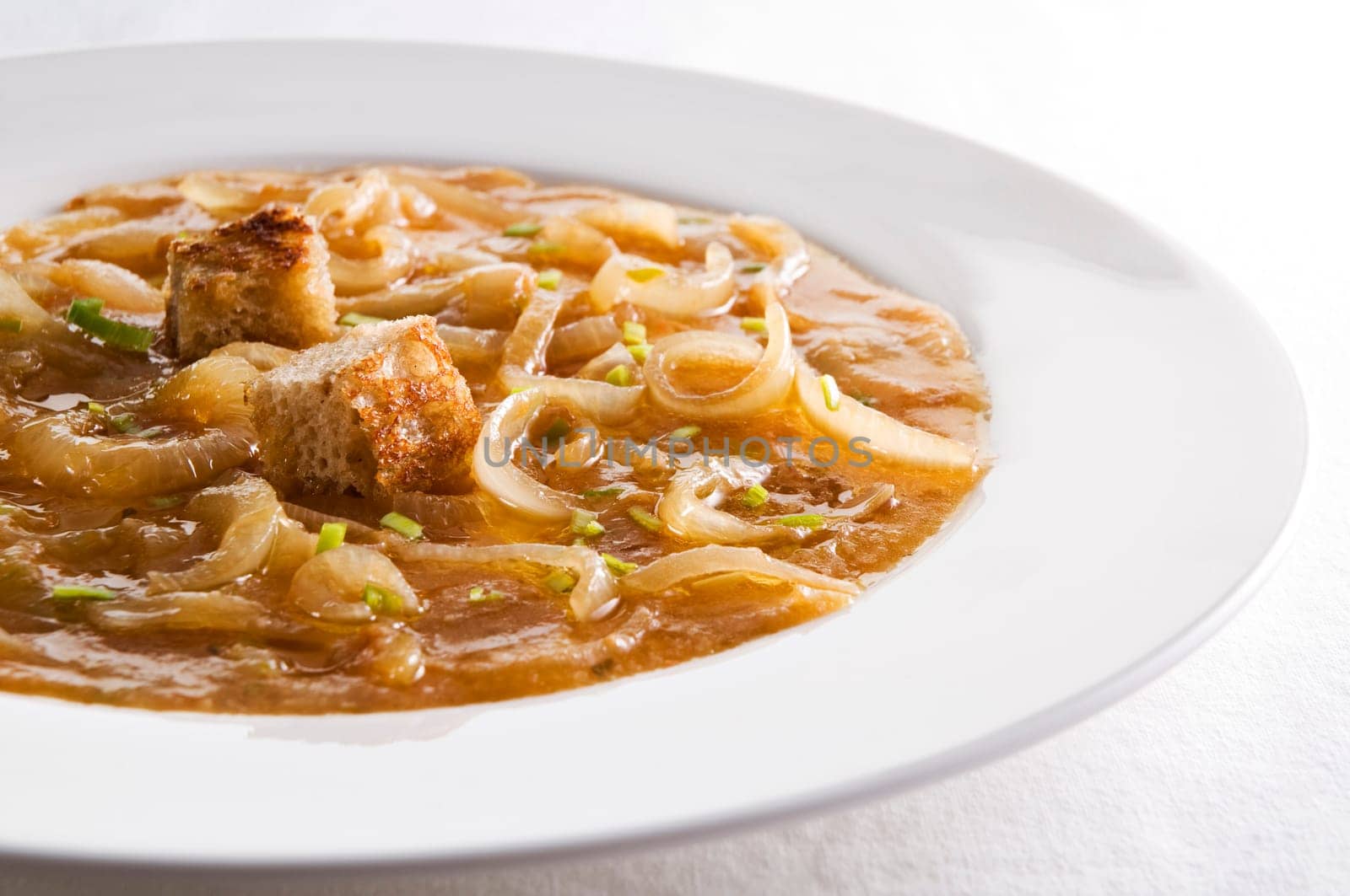 Fresh traditional french onion soup close up