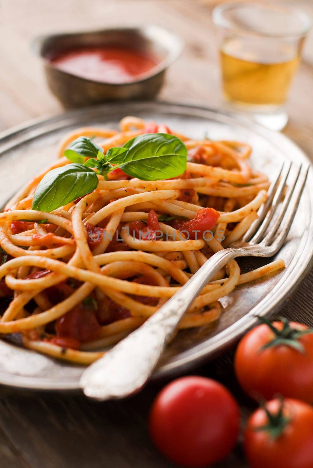 Fresh spaghetti with tomato sauce on a plate close up