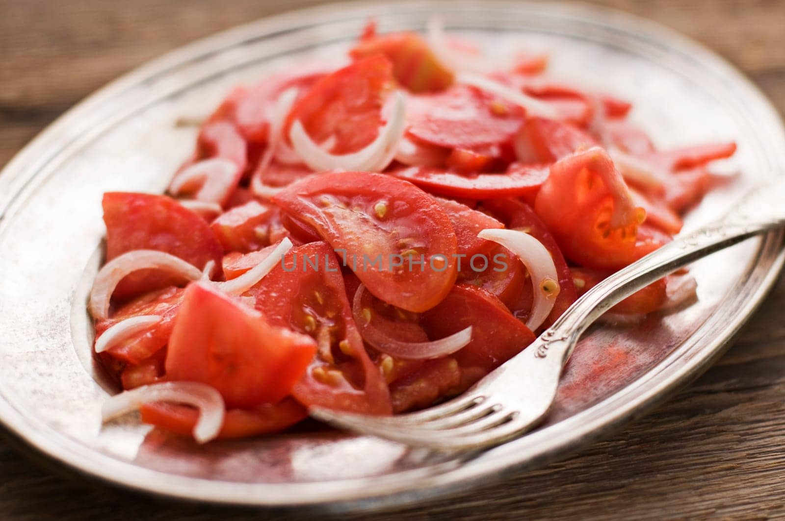 Fresh tomato with onion salad close up shoot