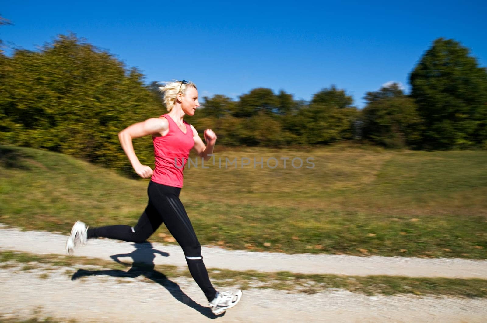 Young woman running outdoor close up shoot