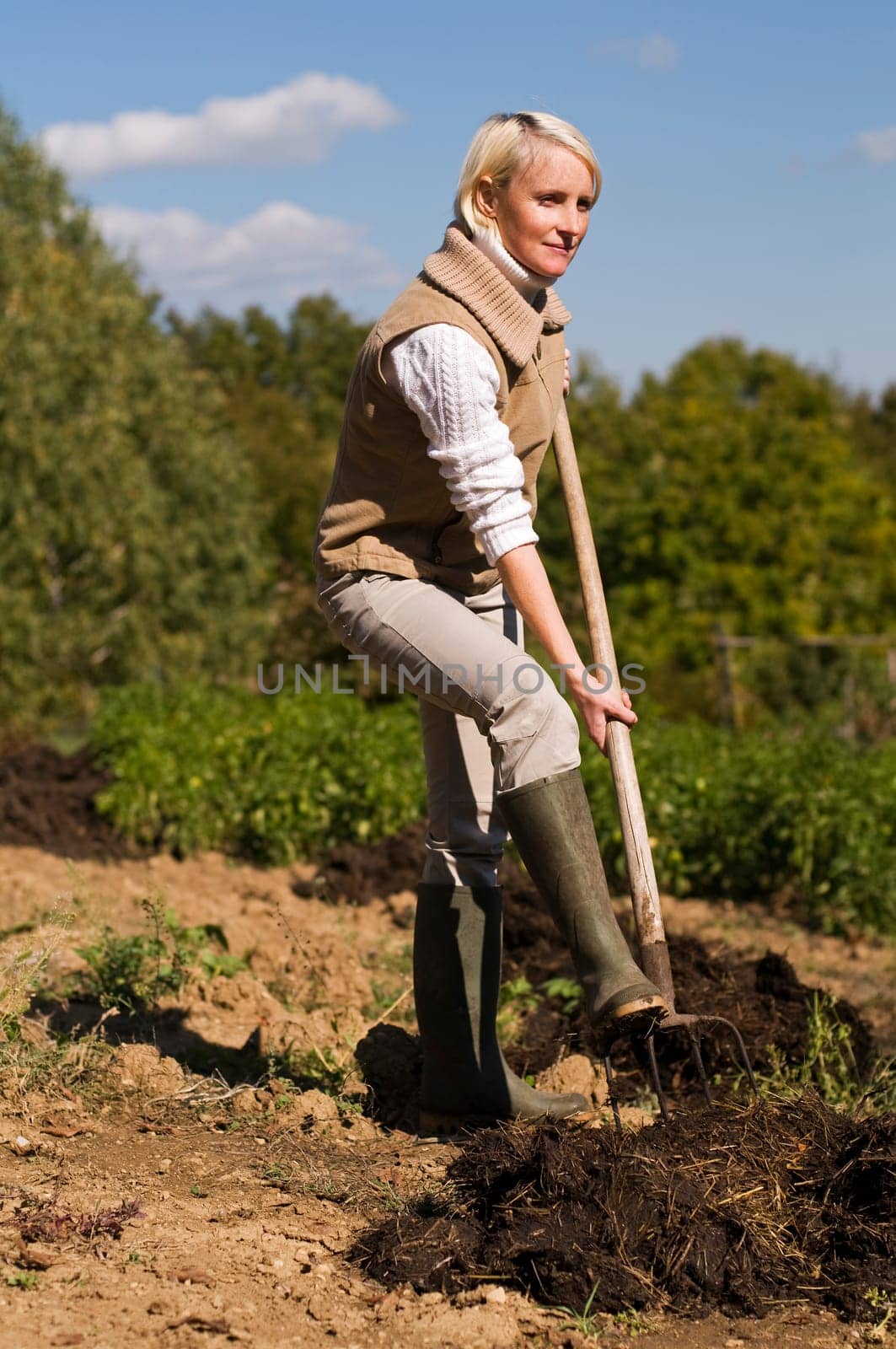 Young woman working on a farm close up shoot