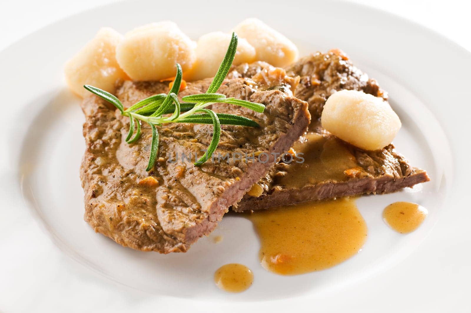 Fresh beef steak with gnocchi close up shoot