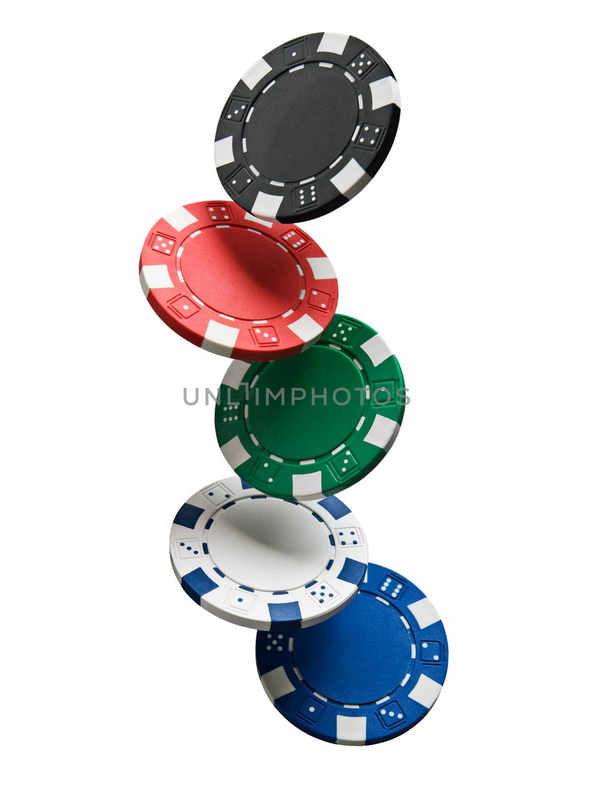 Gambling chips falling isolated on white