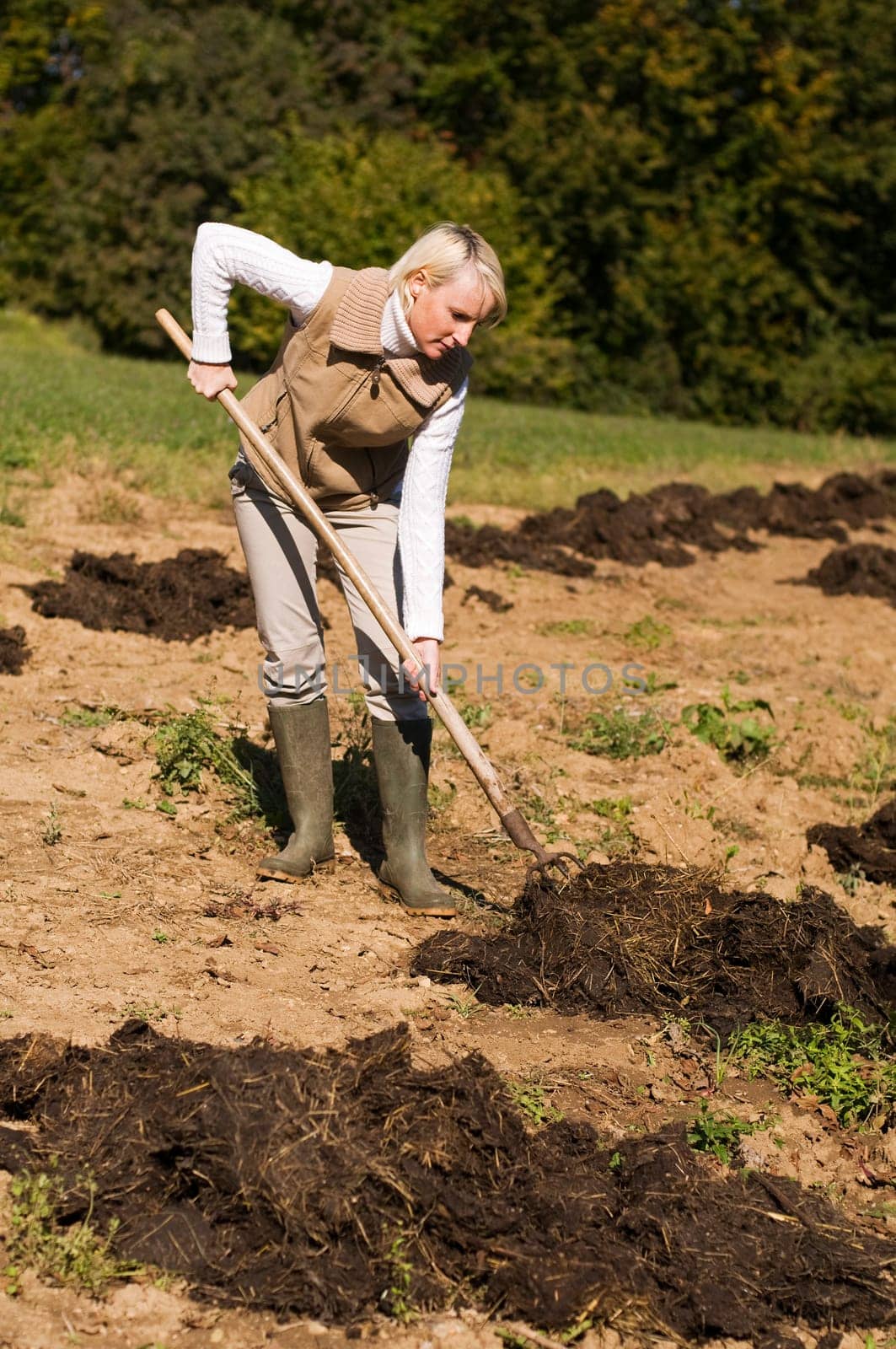 Young woman working on a farm close up shoot
