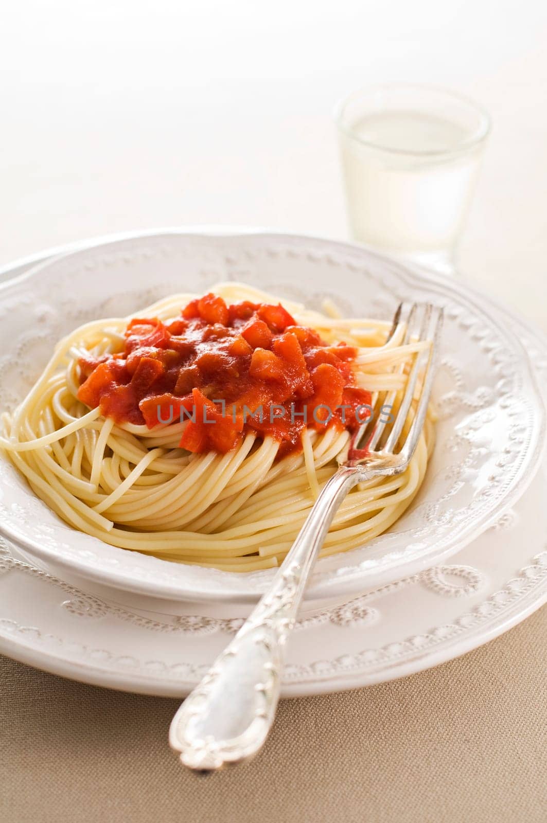 Fresh spaghetti with tomato sauce close up