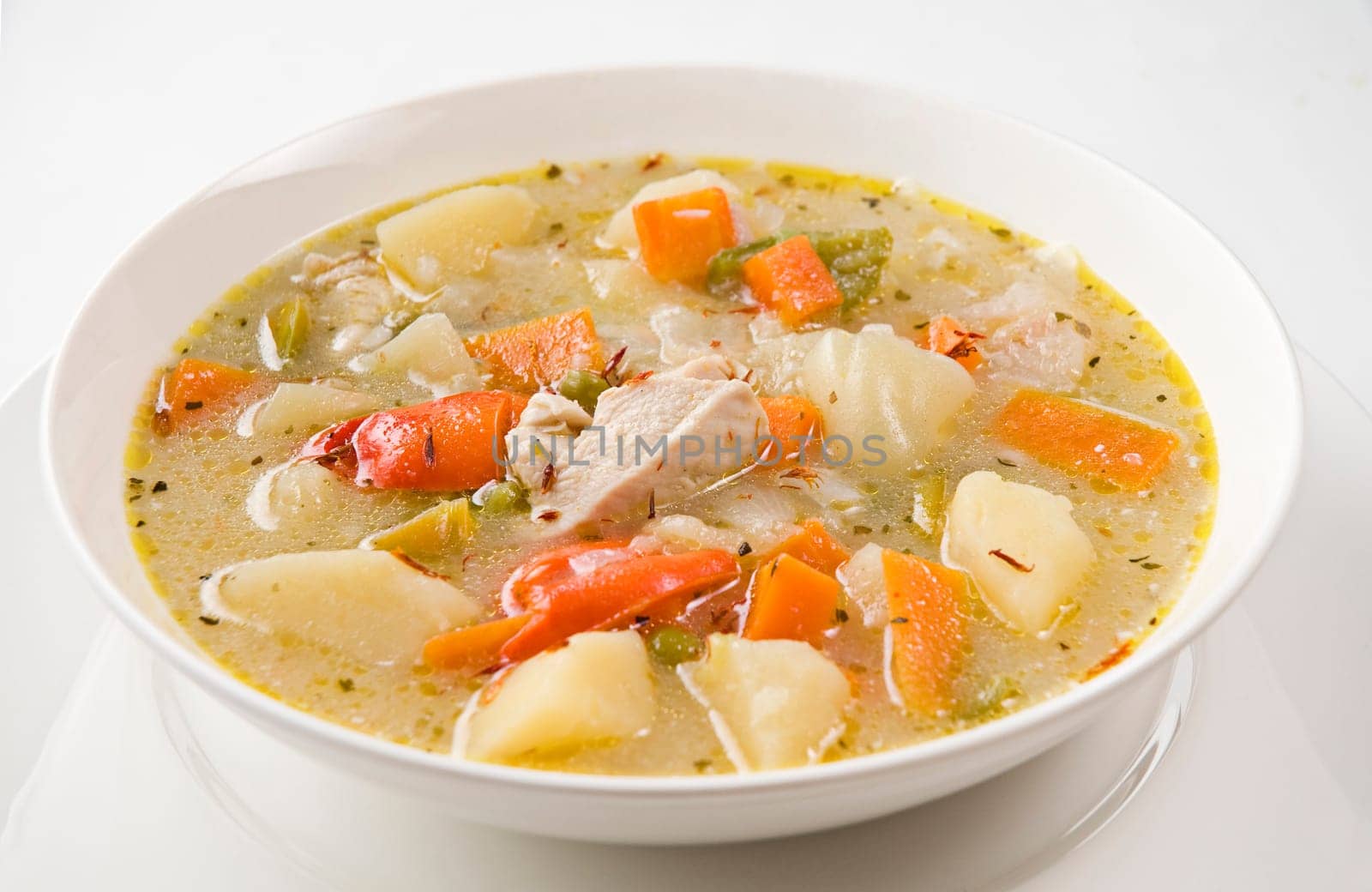 Fresh vegetable soup with chicken close up