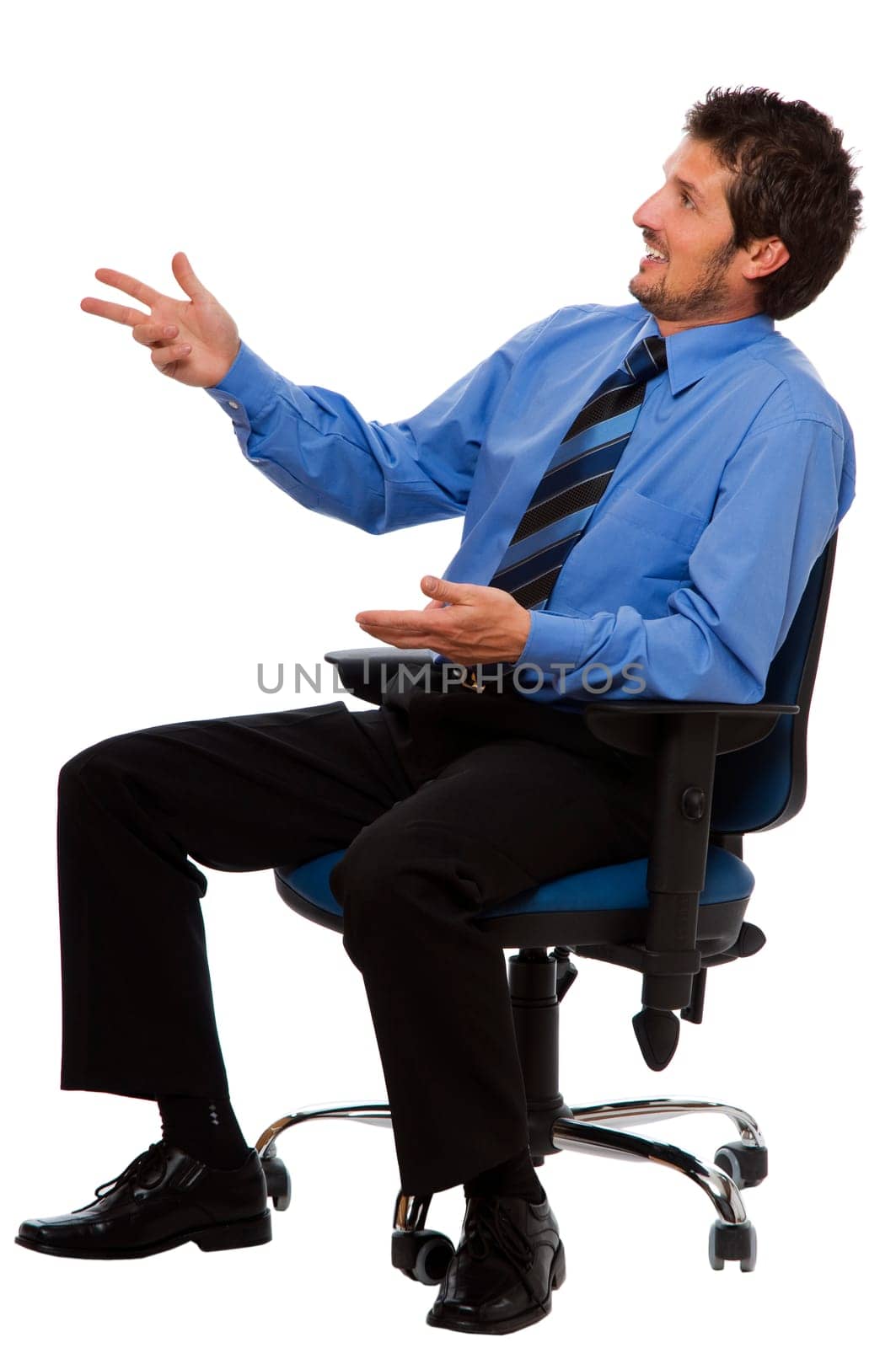 young business man sitting in a chair talking