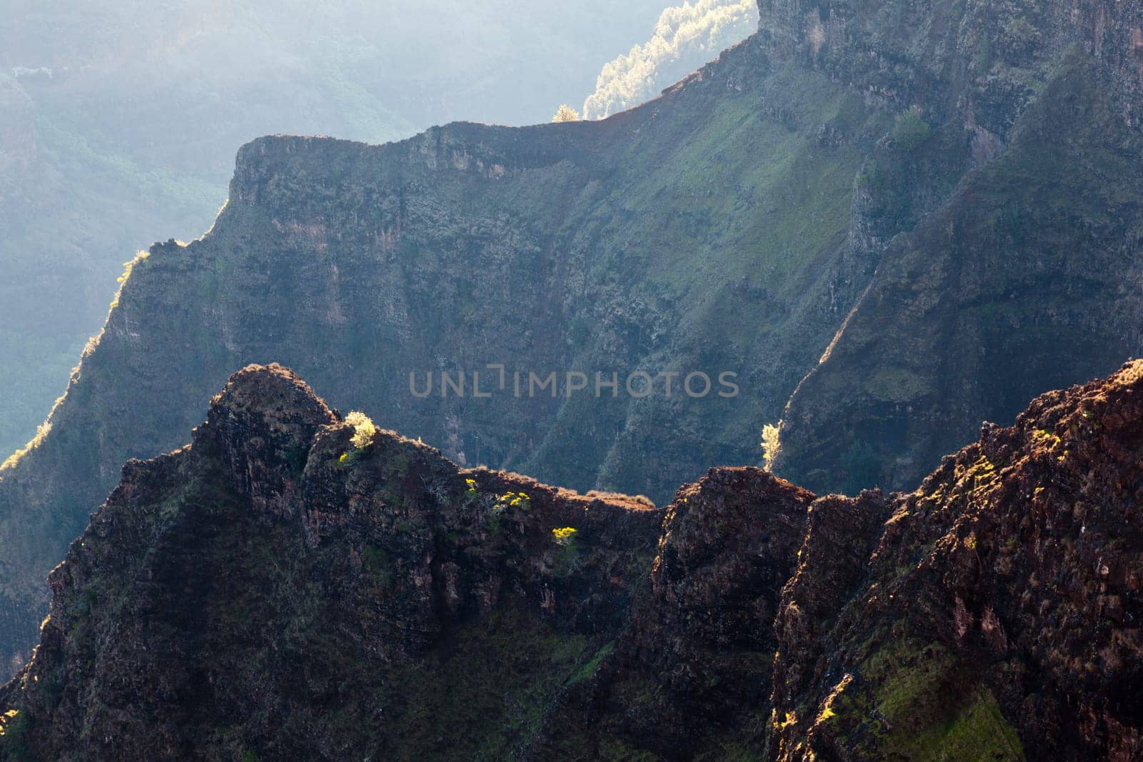 Early light illuminates the steep rock sides of Waimea Canyone on Kauai