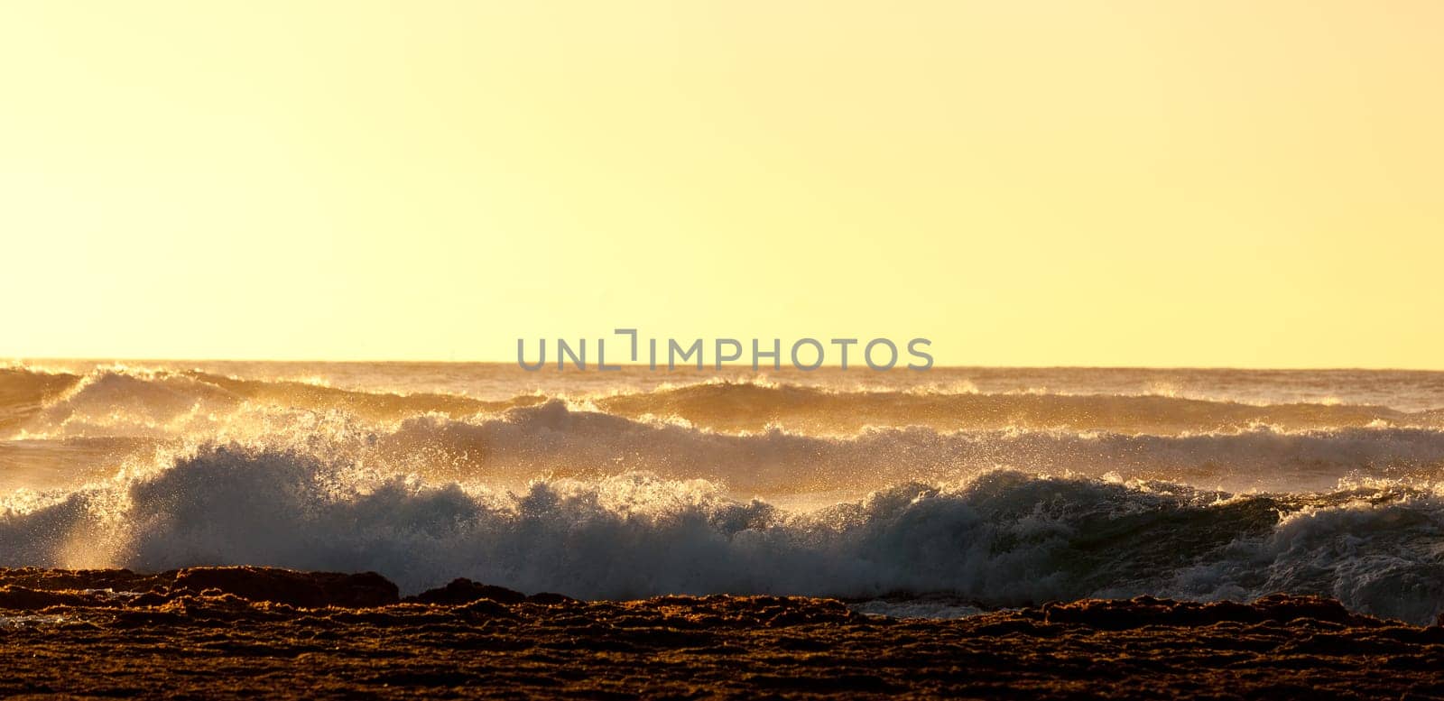 Waves crashing on reef of coast of Kauai off Kee beach