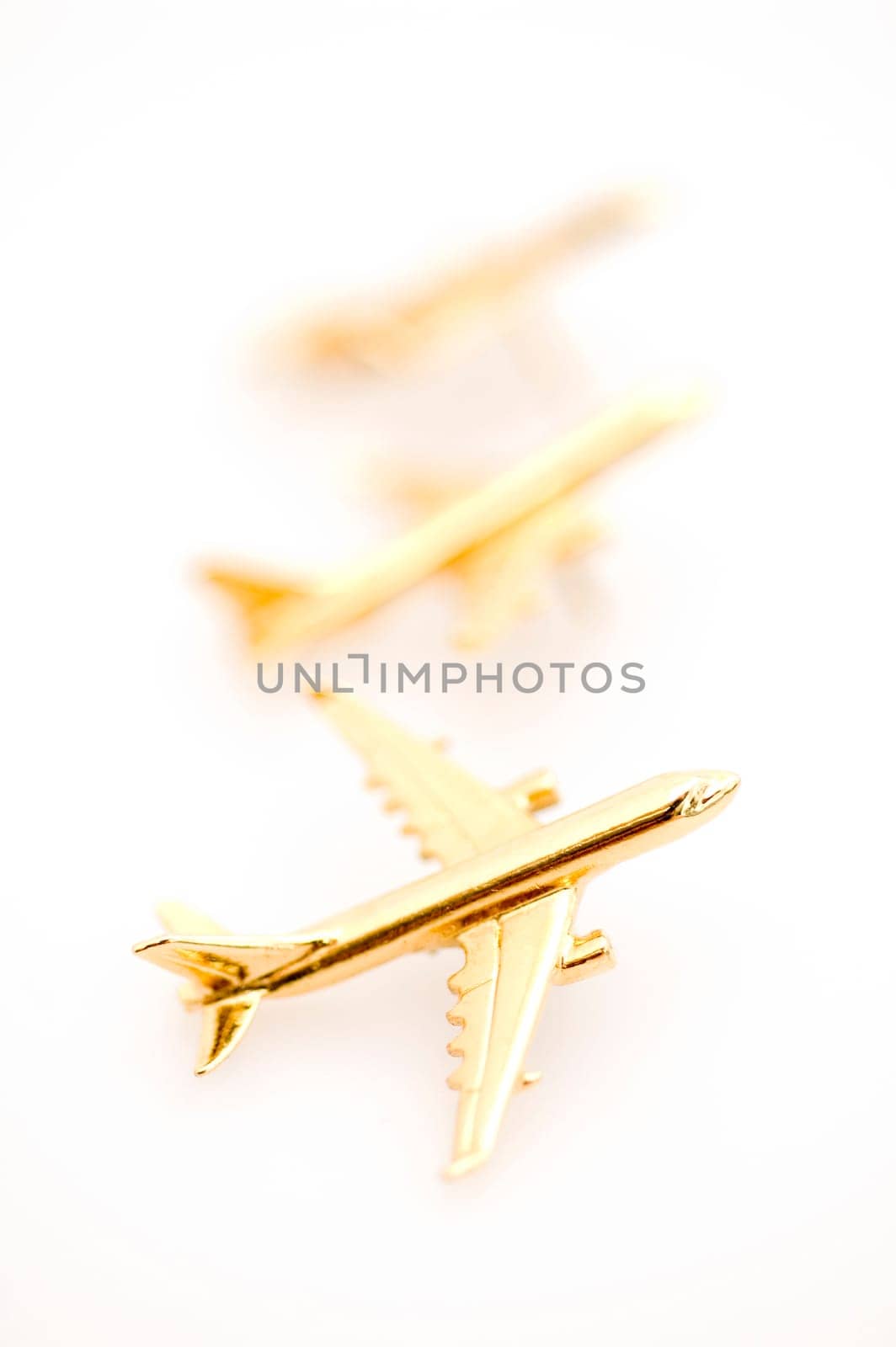 Three Golden Planes, Isolated on a White Background.