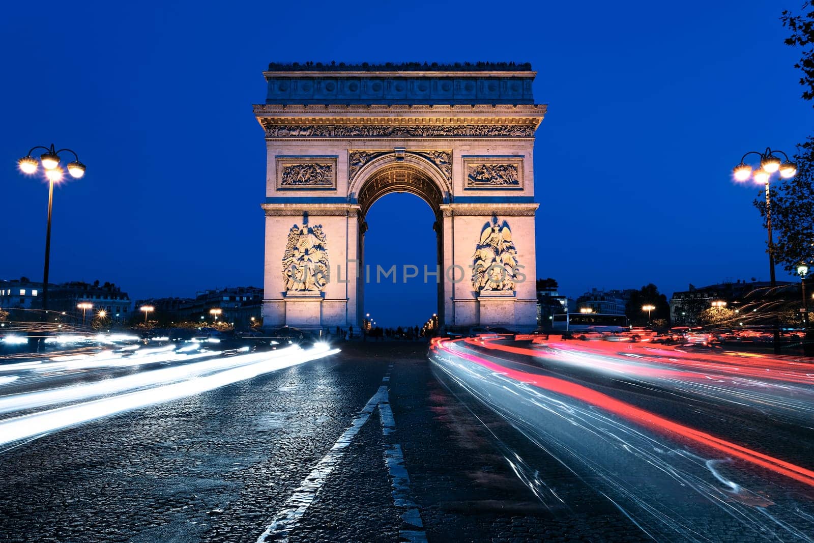 famous Arc de Triomphe by night, Paris France