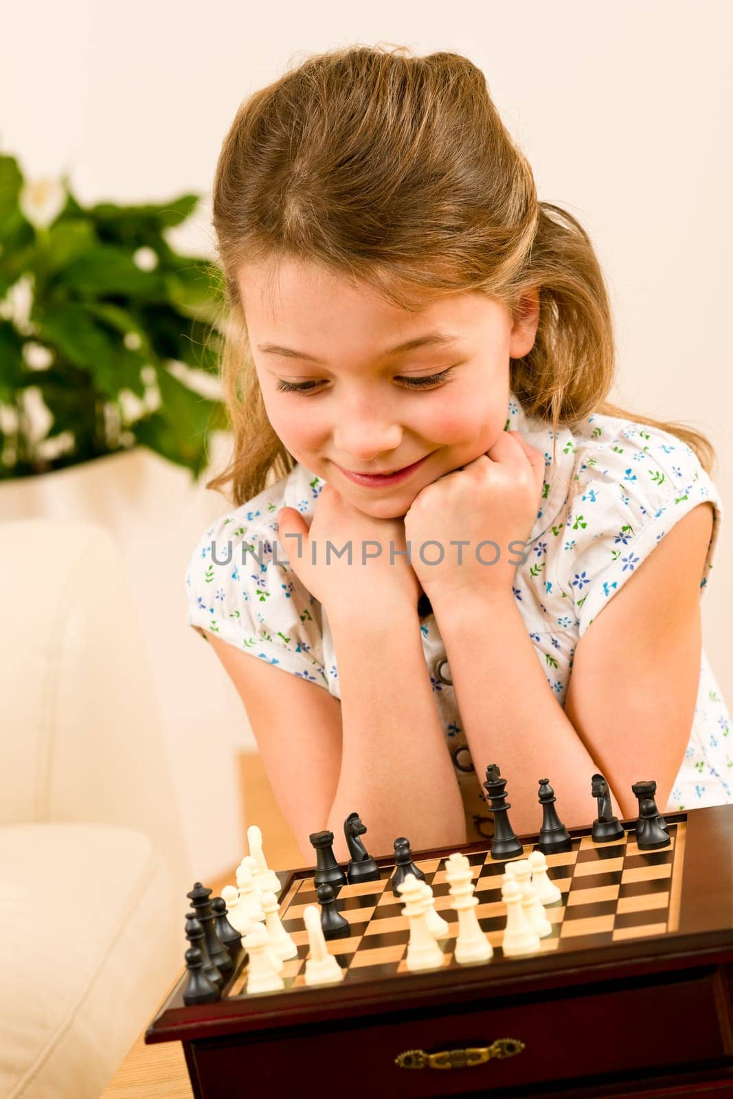 Young girl play chess cute smile alone at home