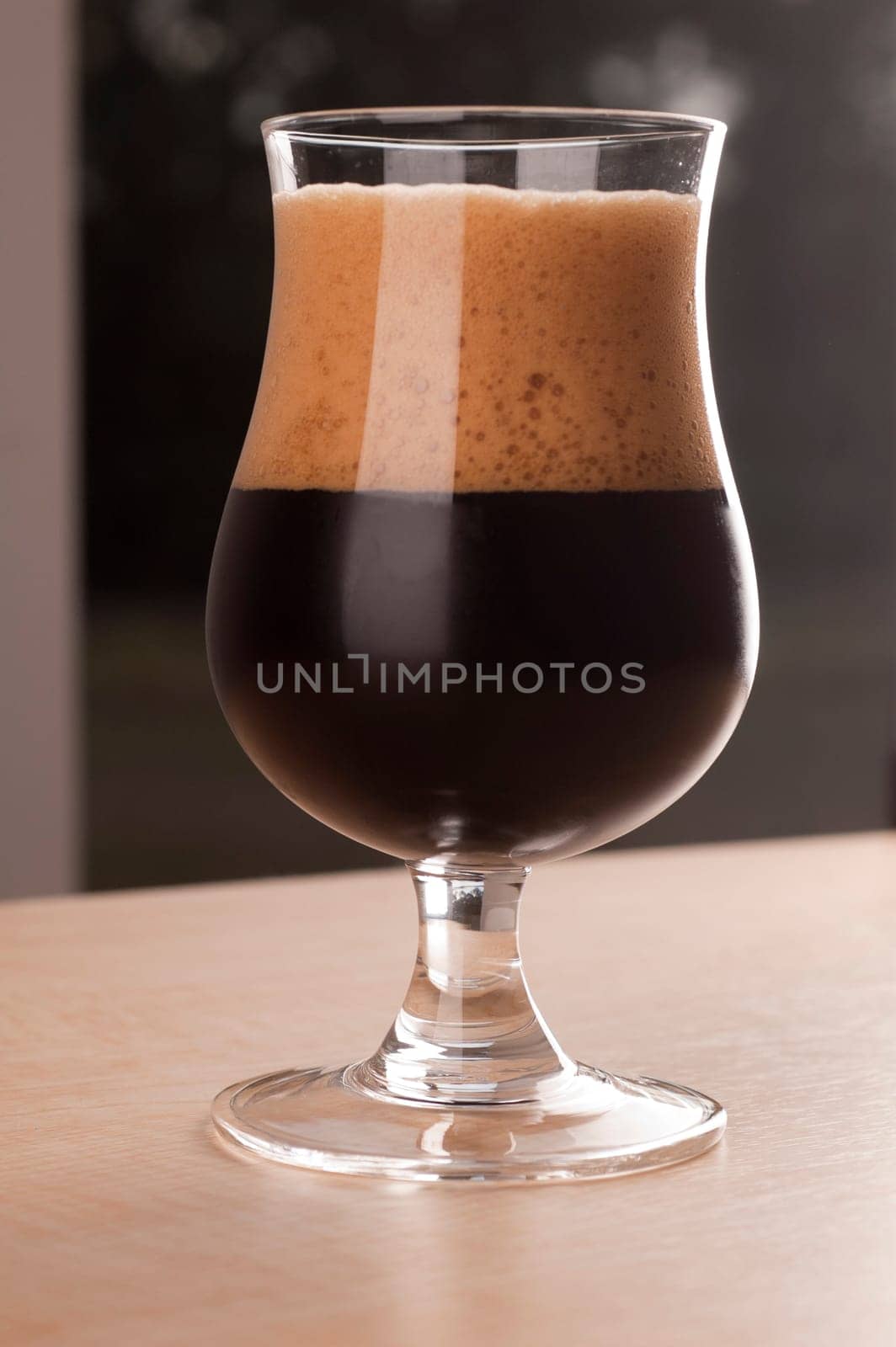 Stout Beer on Wooden Table.