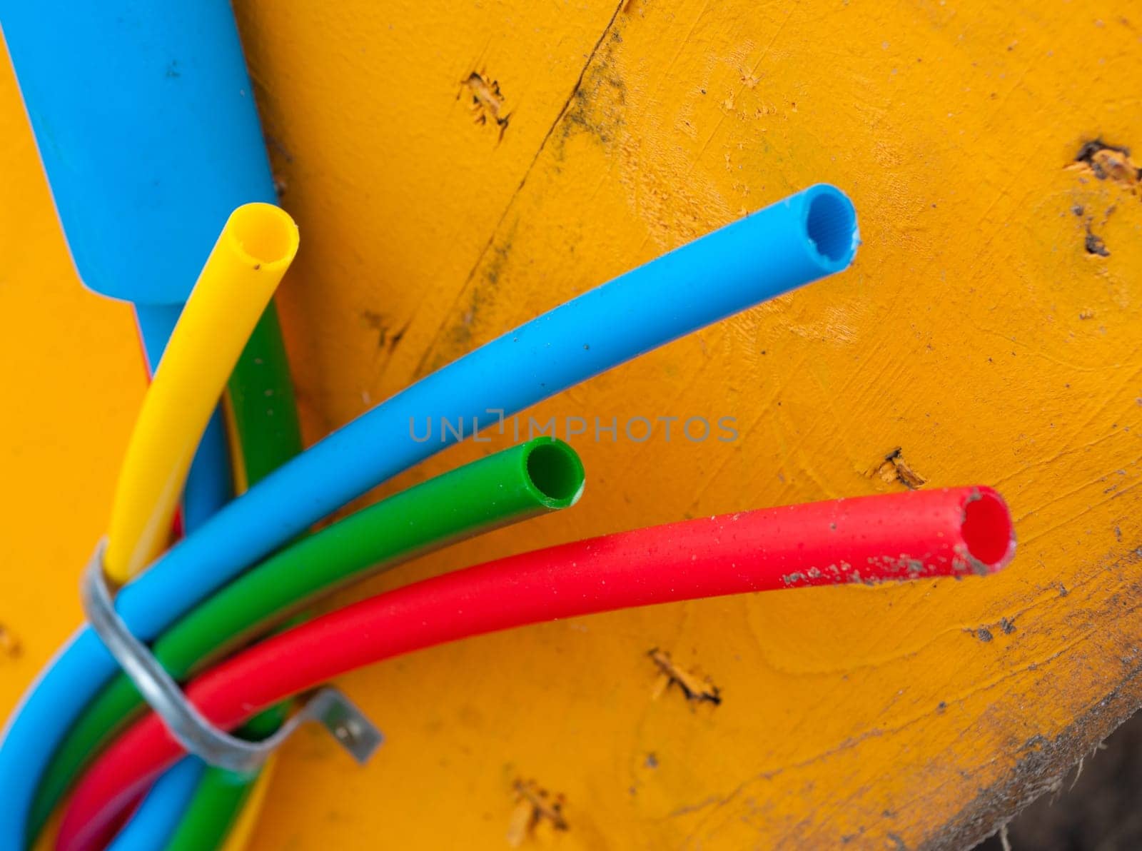 cable on cable drum containing four cables in different colors