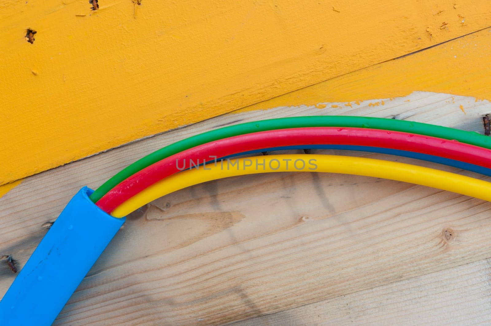 cable on cable drum containing four cables in different colors