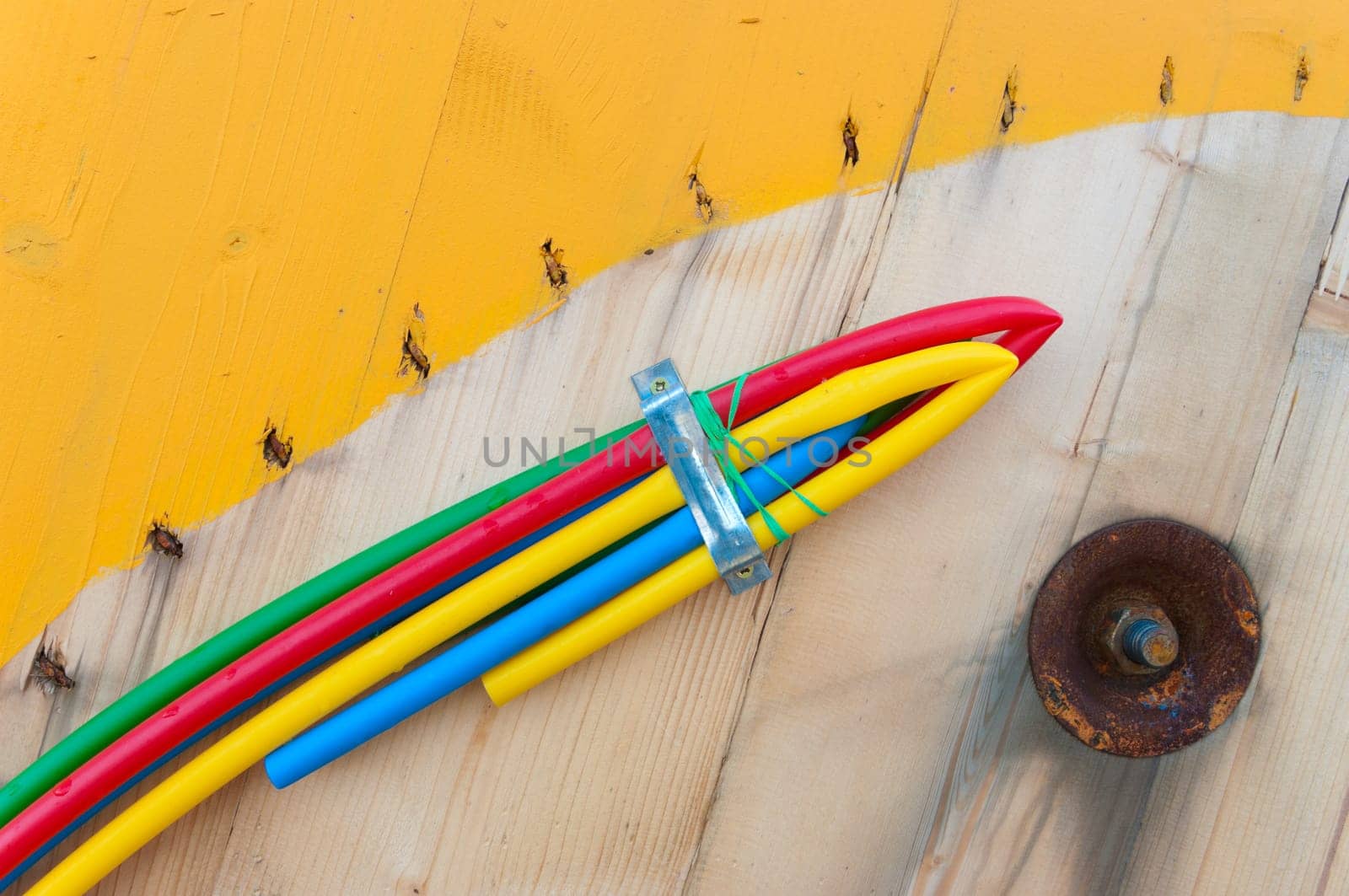 cable on cable drum containing four cables in different colors