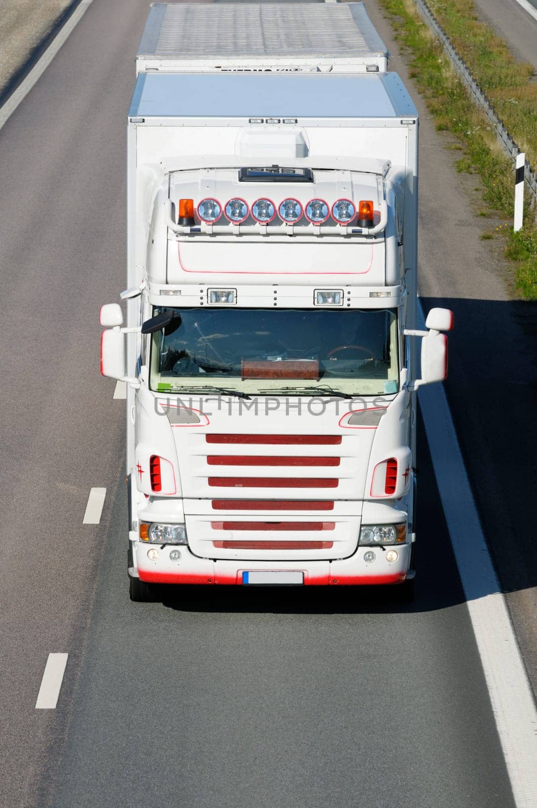 large truck coming head-on, elevated view from above, close-ups