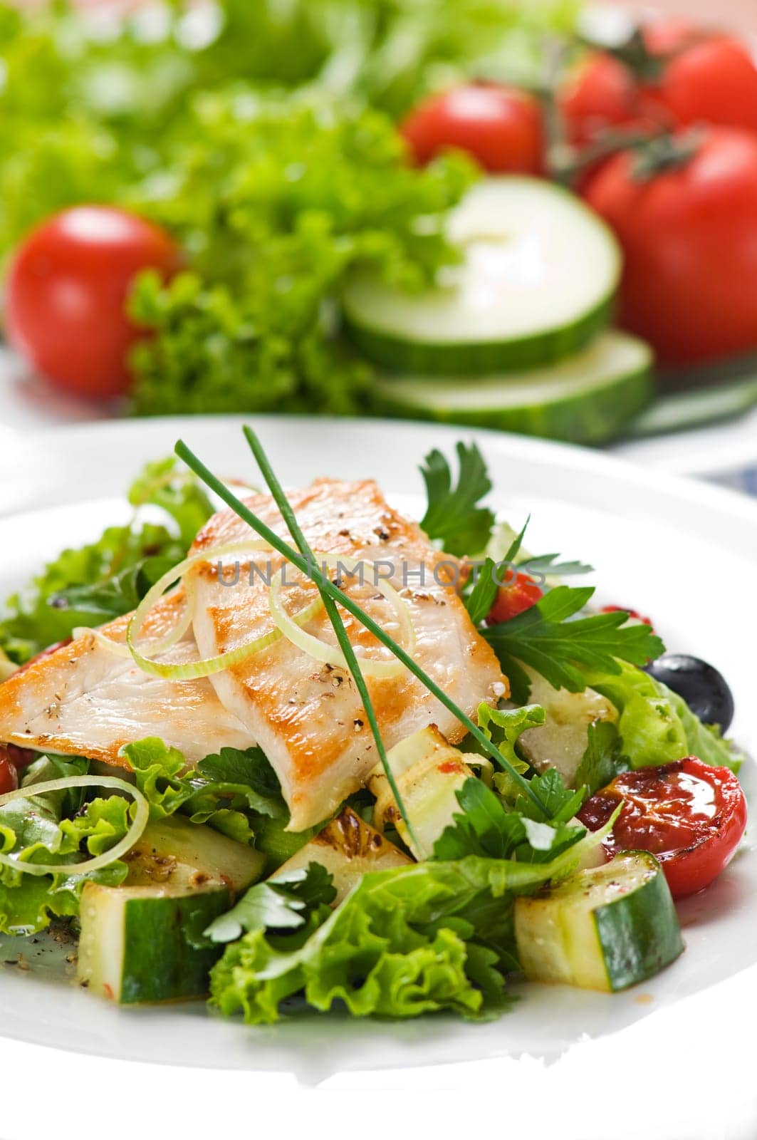 Chicken salad with lettuce and vegetables close up