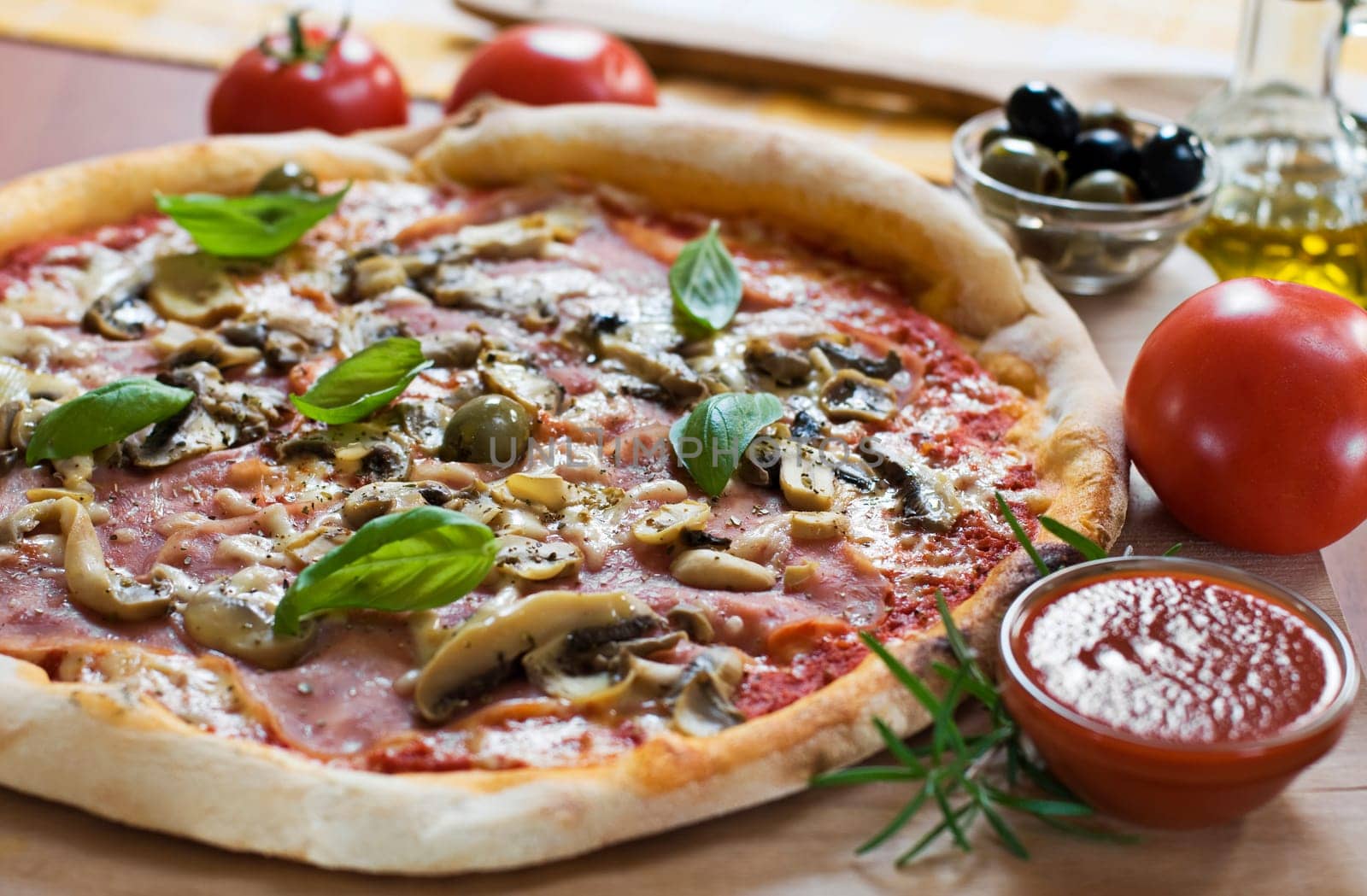 Fresh pizza on wooden board close up shoot