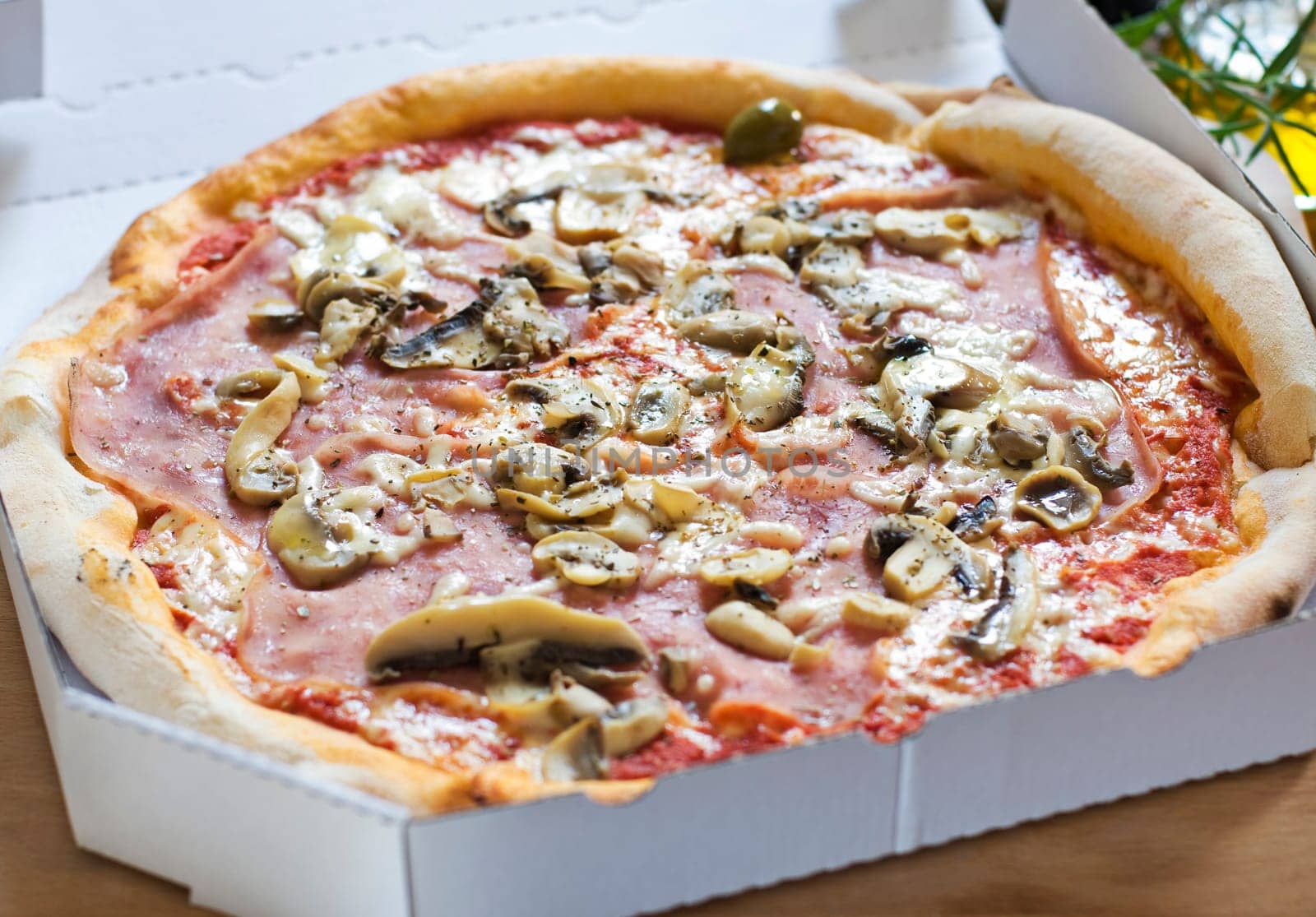 Fresh pizza in a box close up shoot